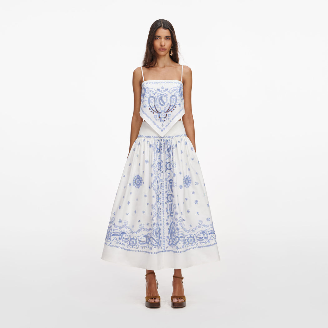 Front view of a woman wearing the White And Blue Embroidered Midi Skirt