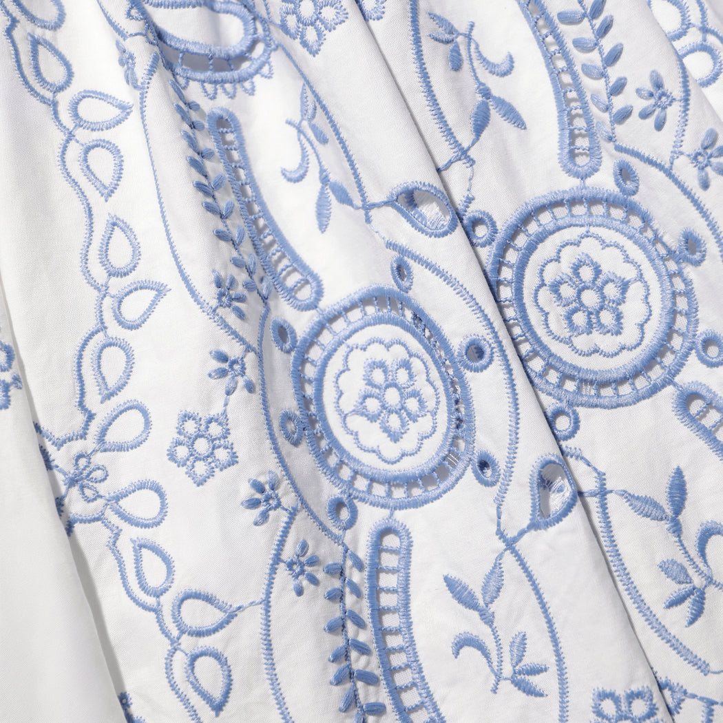 A close up of the fabric for the White And Blue Embroidered Midi Skirt