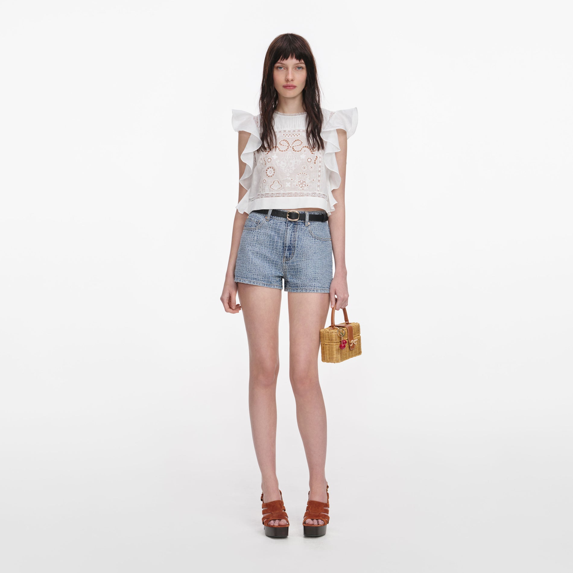 Front view of a woman wearing the White Ramie Lace Frill Top