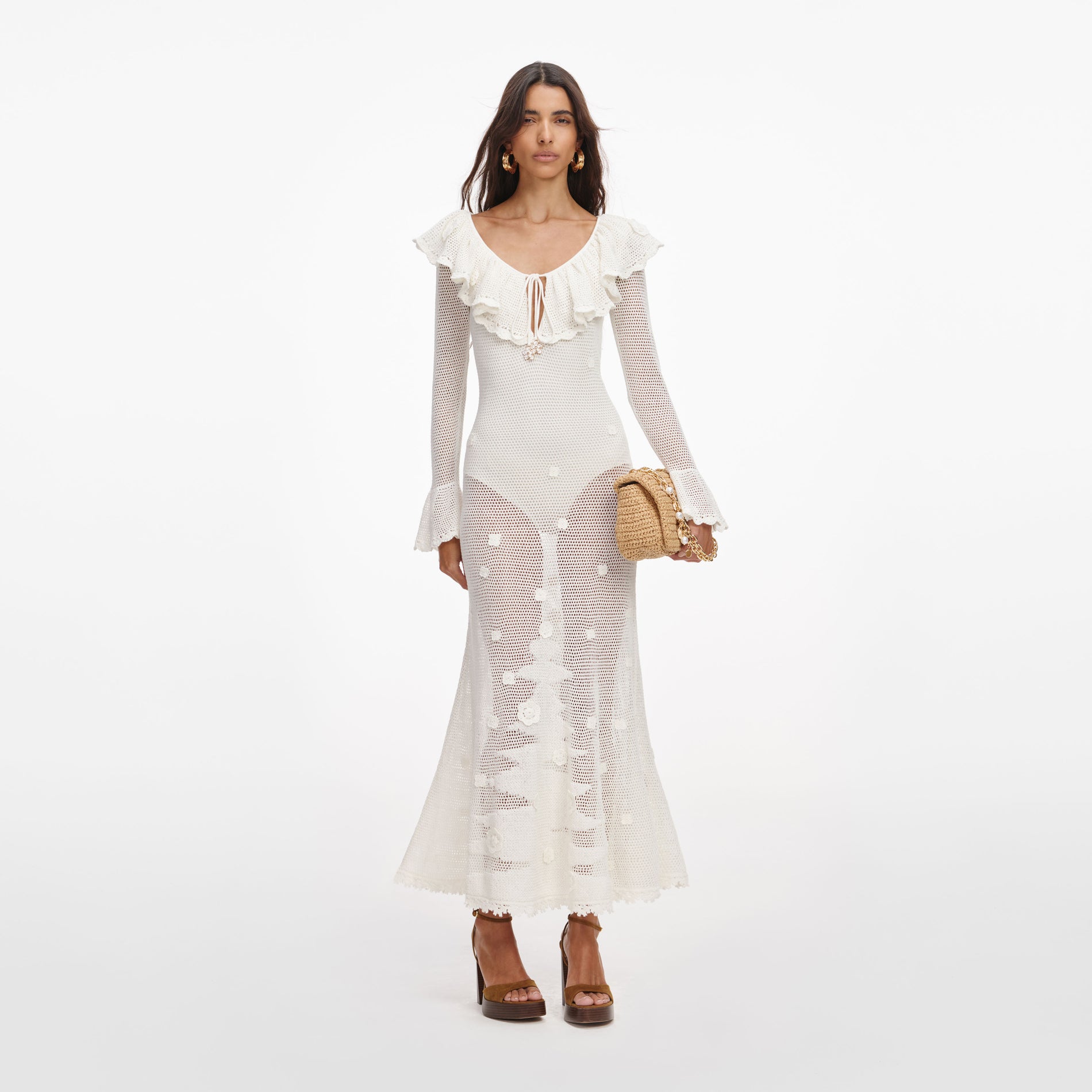 Front view of a woman wearing the White Floral Crochet Midi Dress