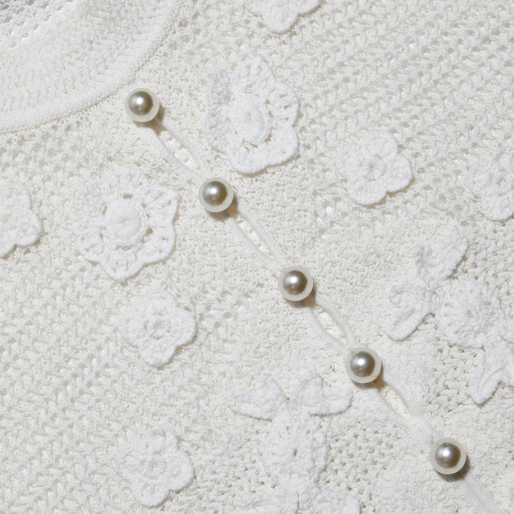 A close up of the fabric for the White Floral Crochet Top