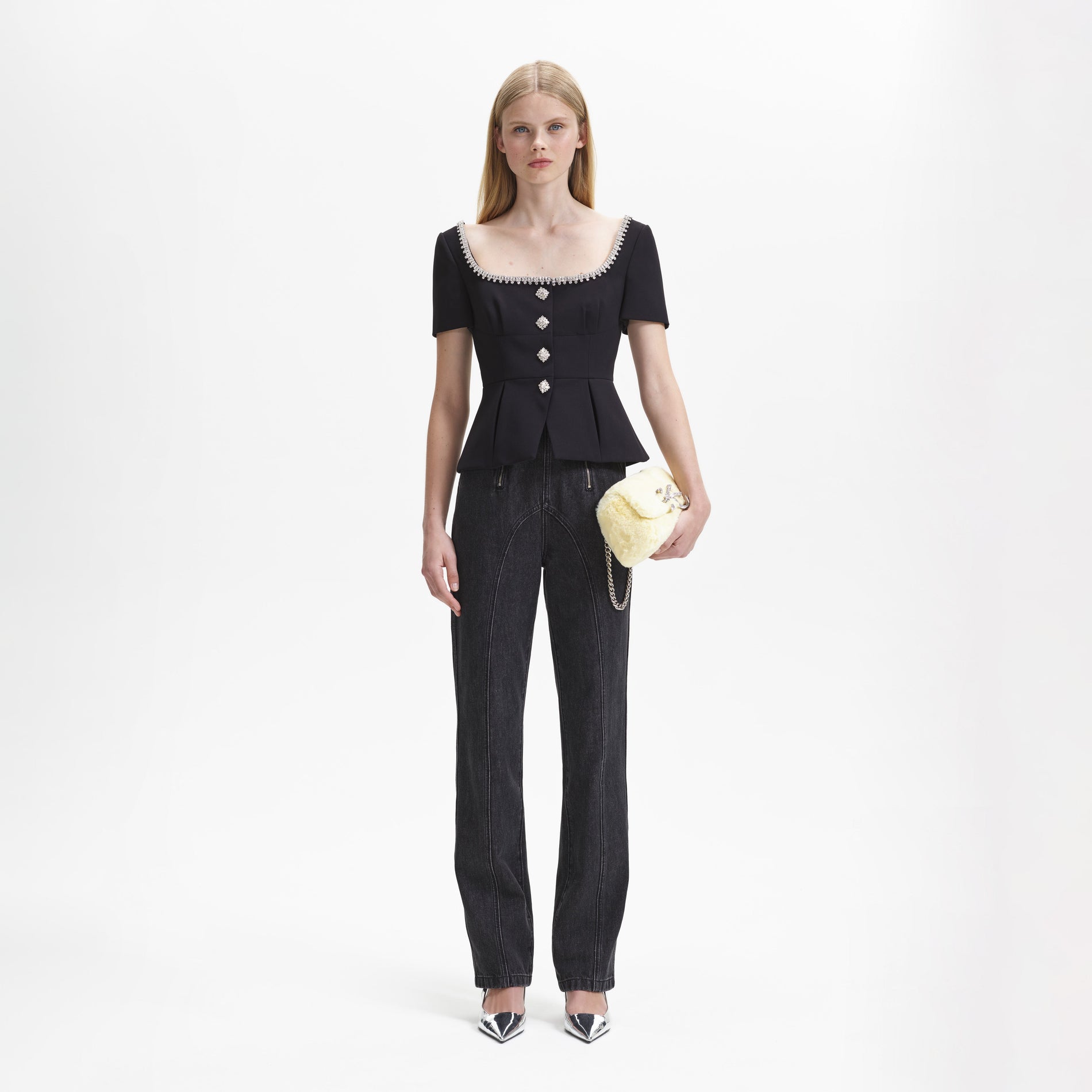 A woman wearing the Black Bonded Crepe Top