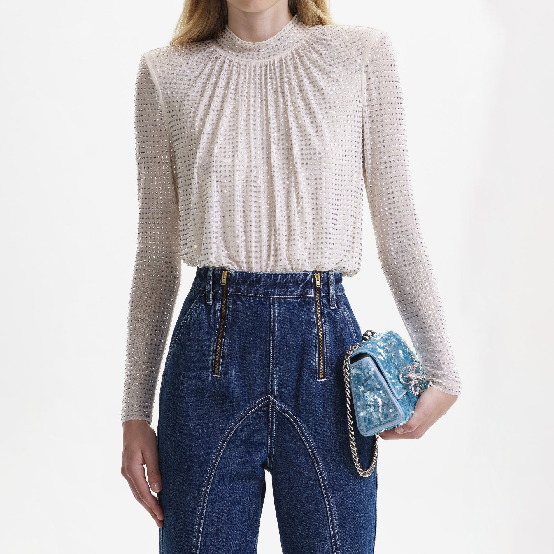 A close up of the fabric for the Cream Rhinestone Mesh Top