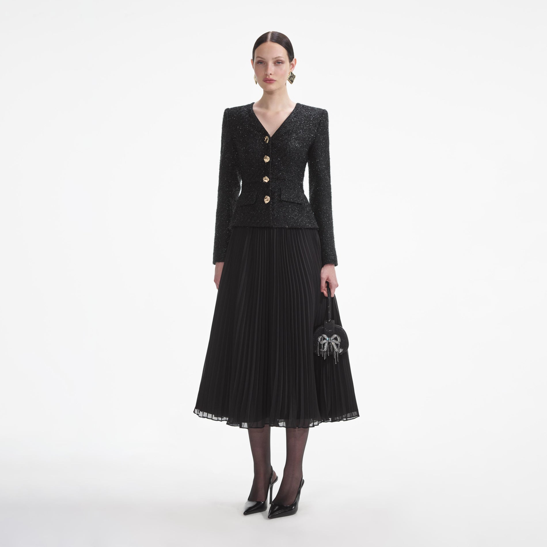 Side view of a woman wearing the Black Tinsel Boucle Chiffon Midi Dress