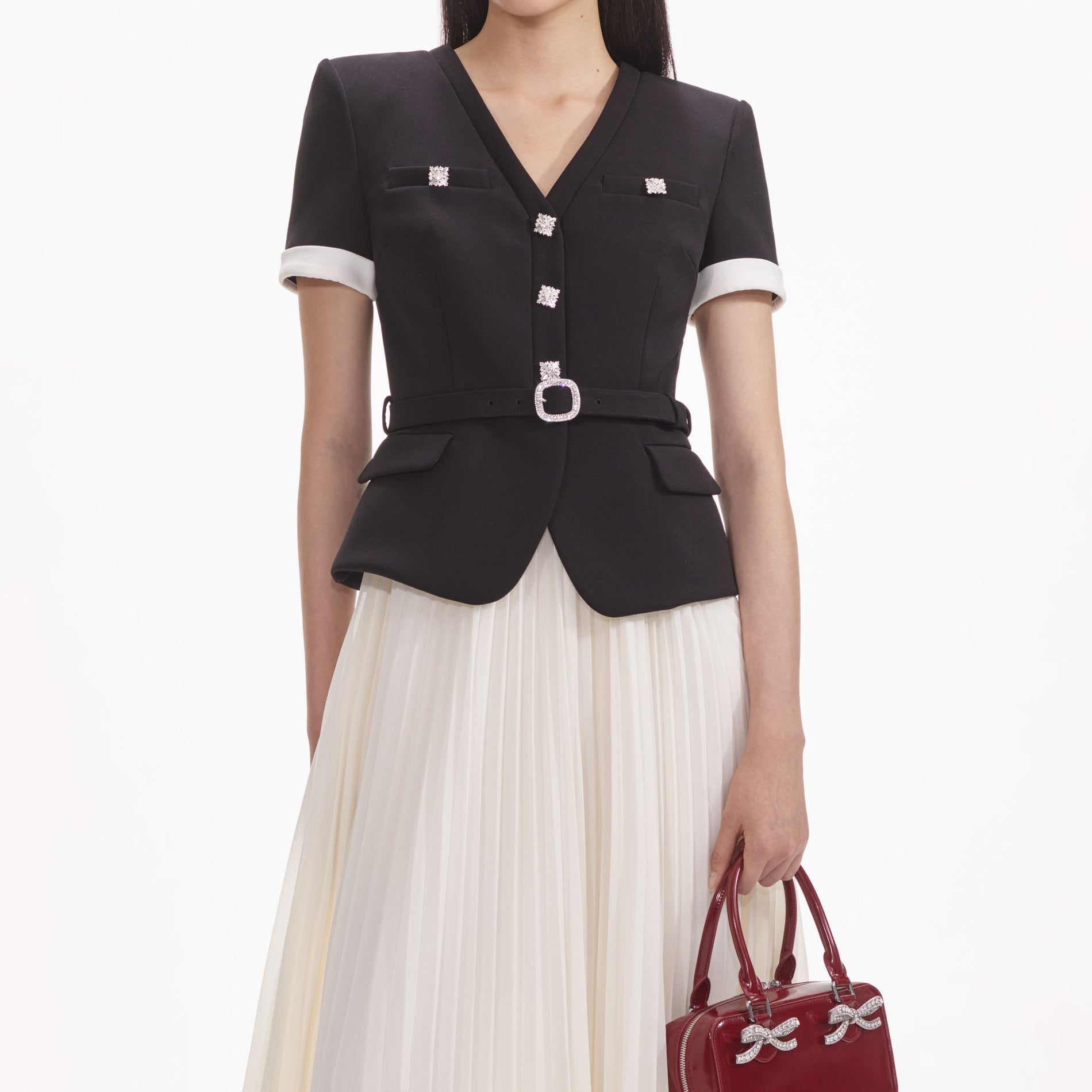 A close up of a woman wearing the Black Crepe Contrast Chiffon Midi Dress