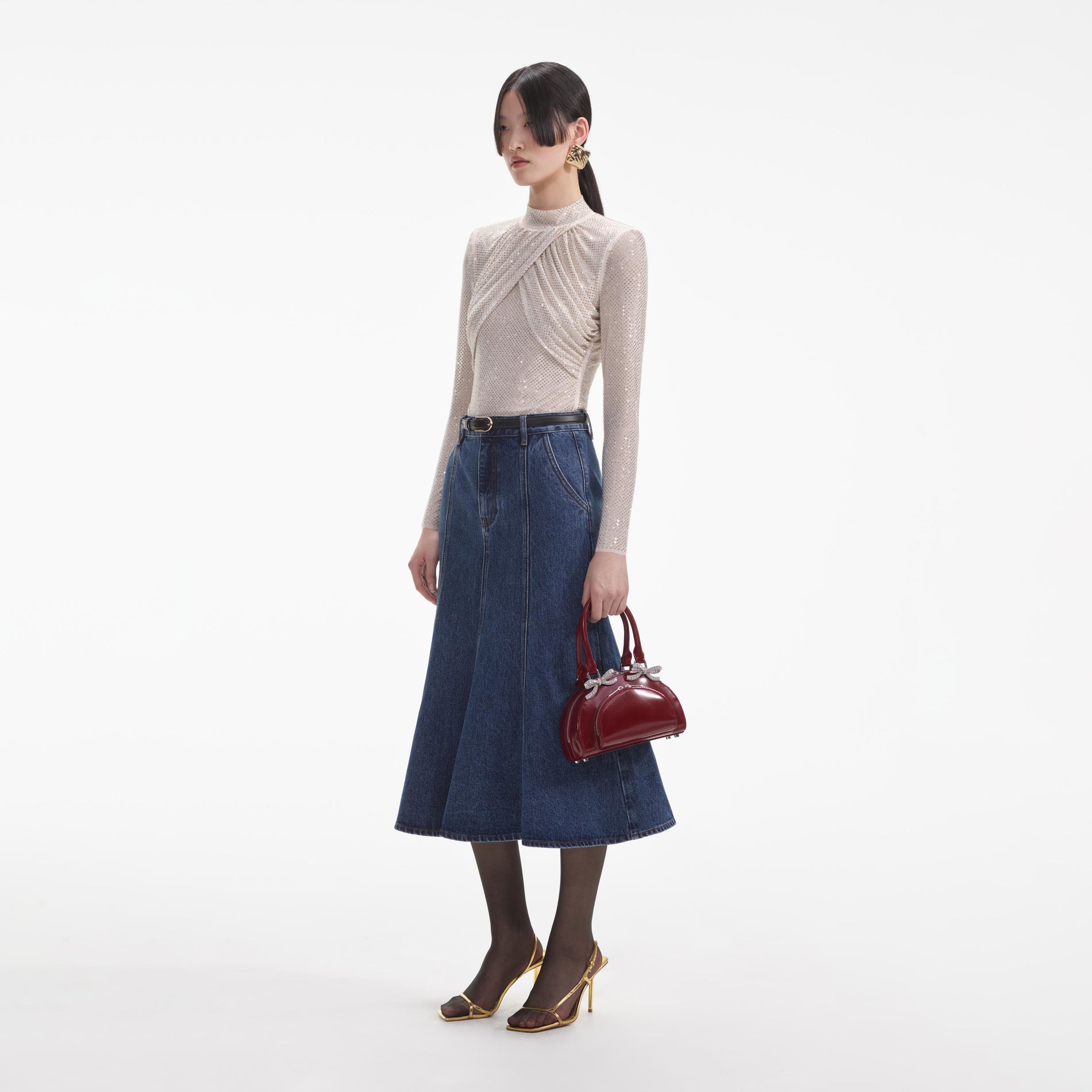 Side view of a woman wearing the Champagne Rhinestone Mesh Top