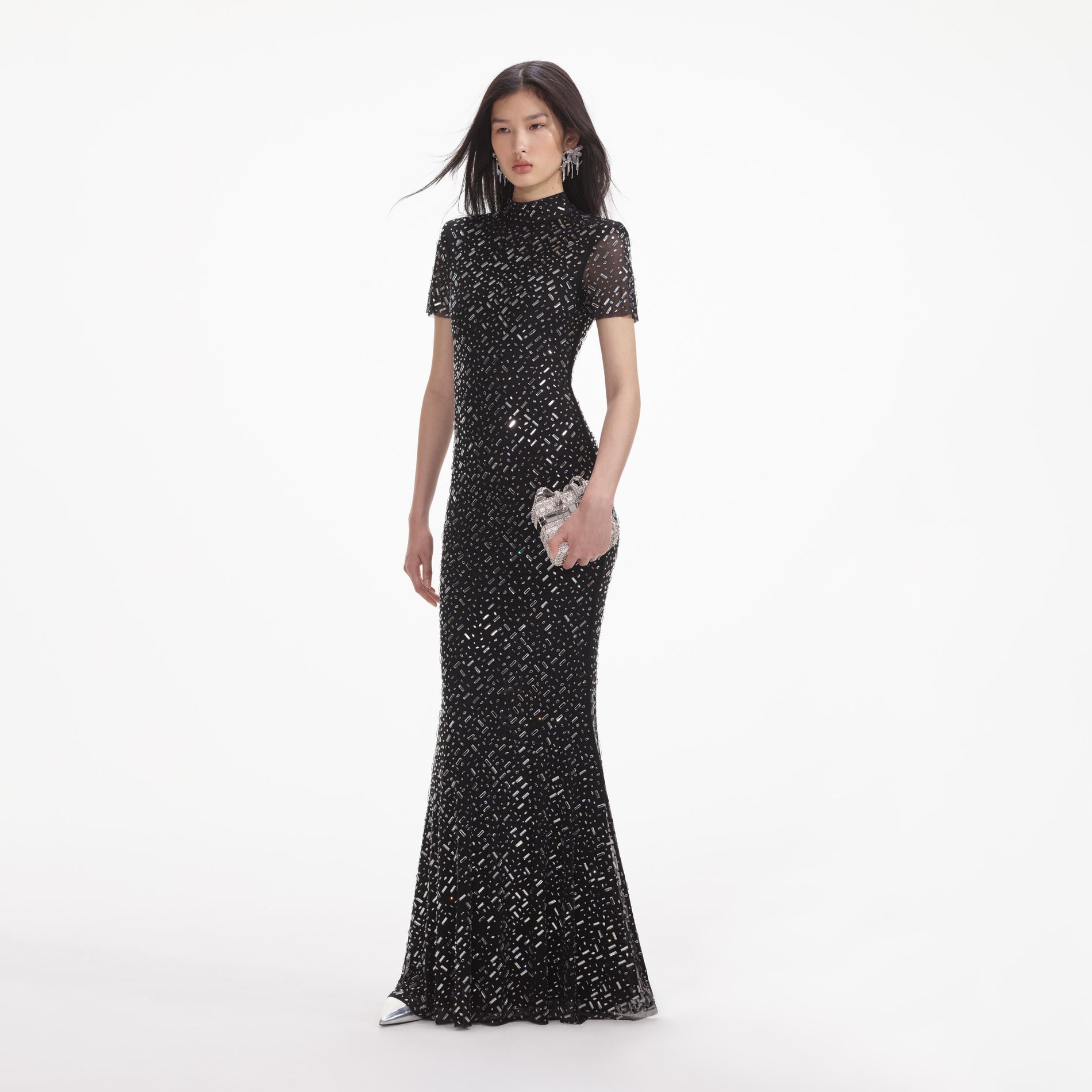 Side view of a woman wearing the Black Square Rhinestone Mesh Maxi Dress