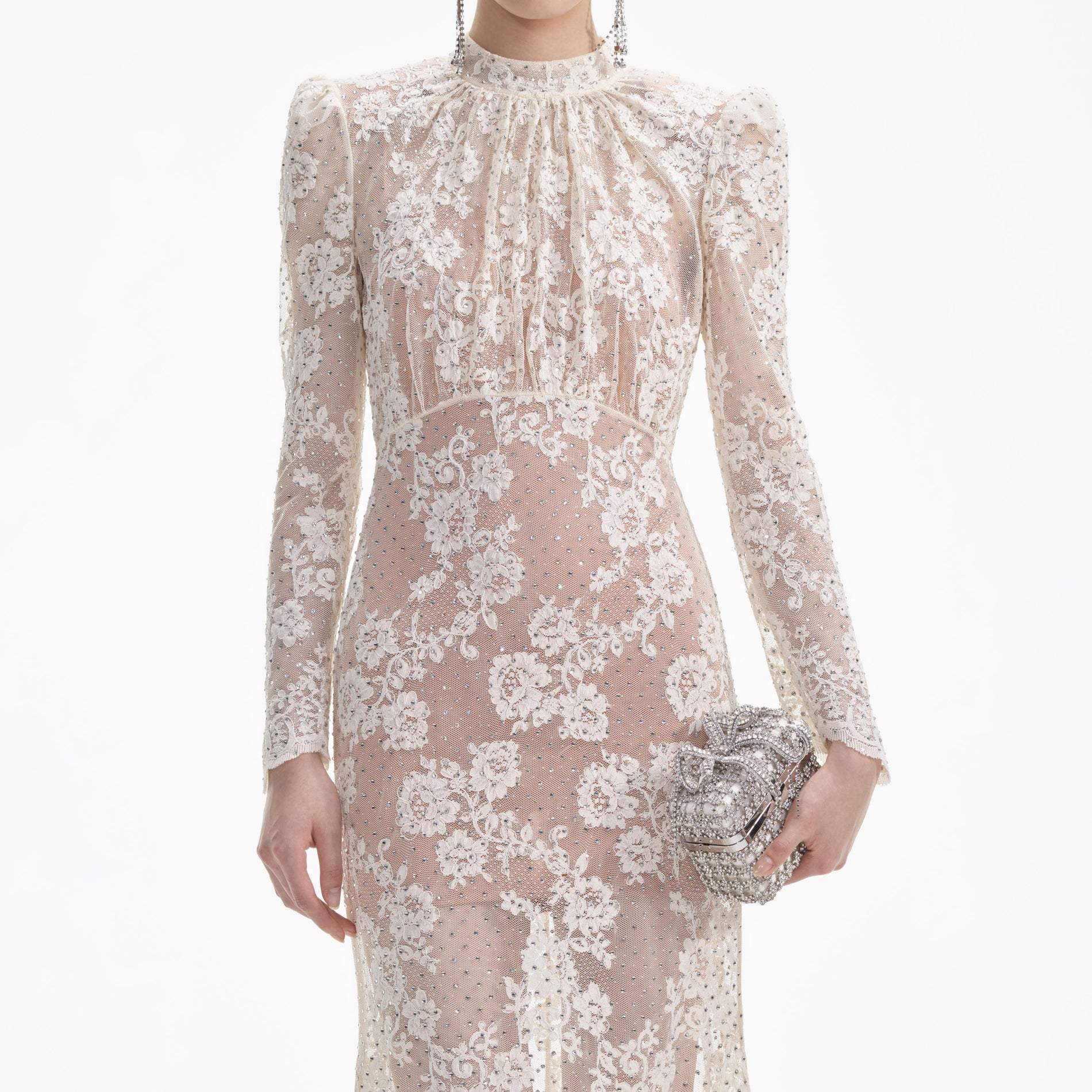 A close up of a woman wearing the White Rhinestone Lace Maxi Dress