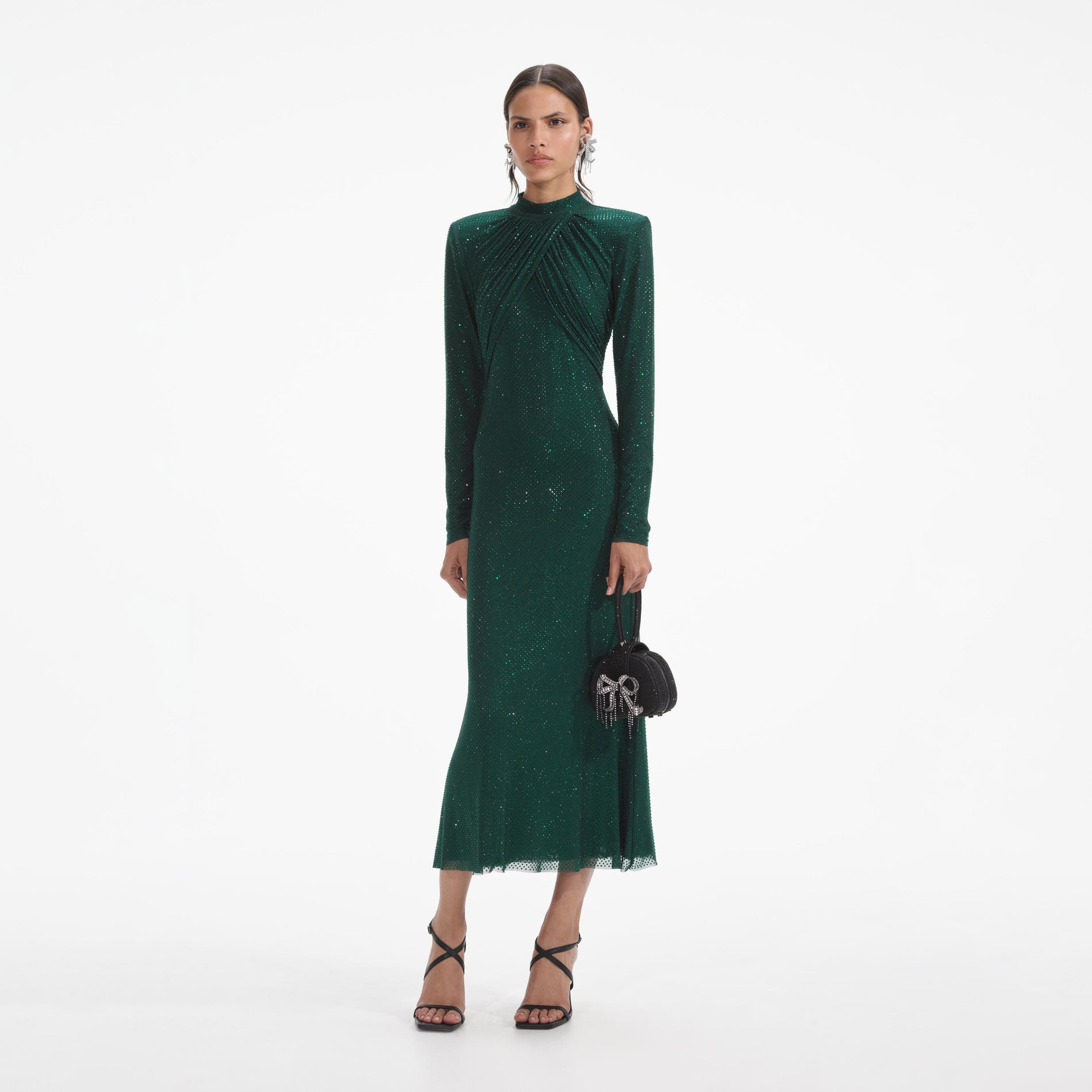 Side view of a woman wearing the Green Rhinestone Mesh Midi Dress