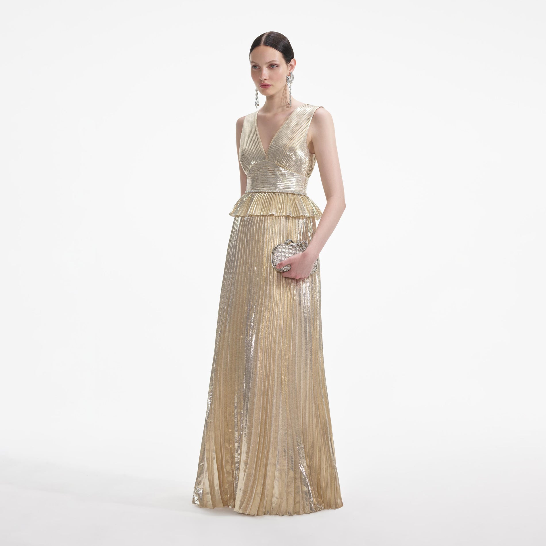 Side view of a woman wearing the Gold Metallic V-Neck Maxi Dress