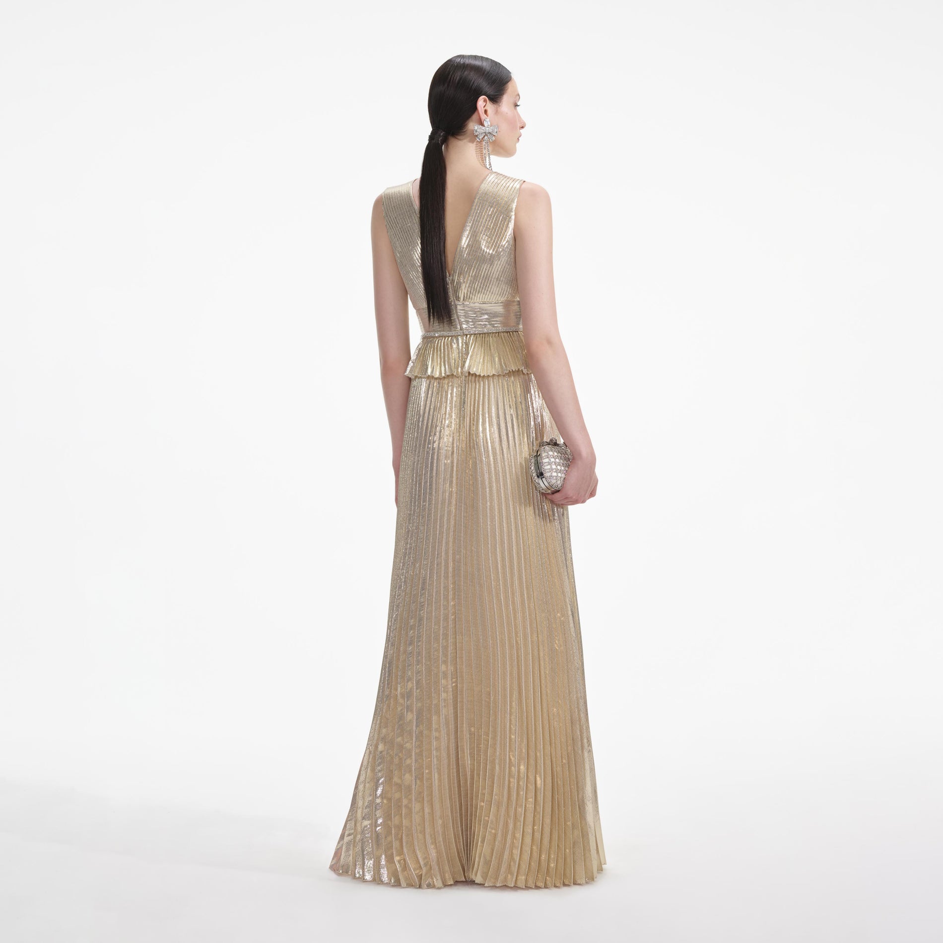 Back view of a woman wearing the White Gold Metallic V-Neck Maxi Dress
