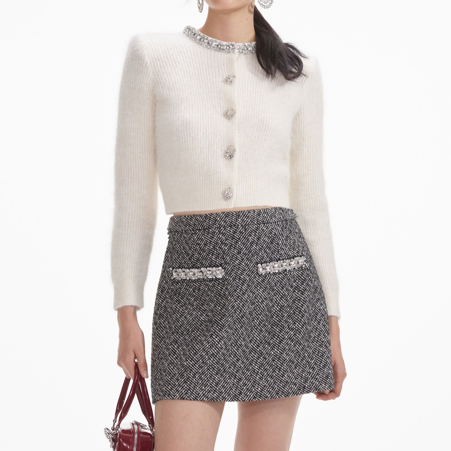 A close up of a woman wearing the Cream Soft Knit Cardigan