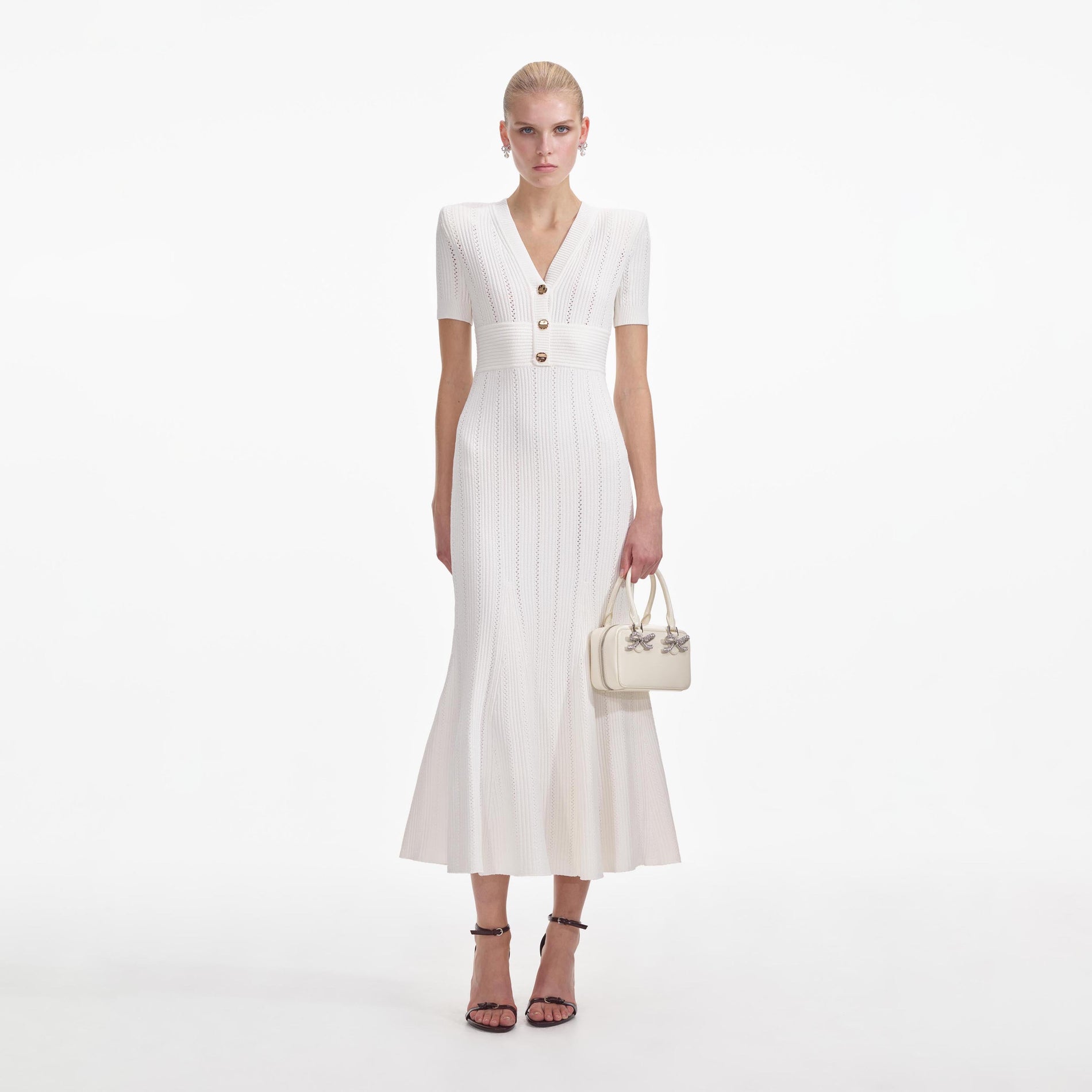 Front view of a woman wearing the Cream Pointelle Knit Midi Dress
