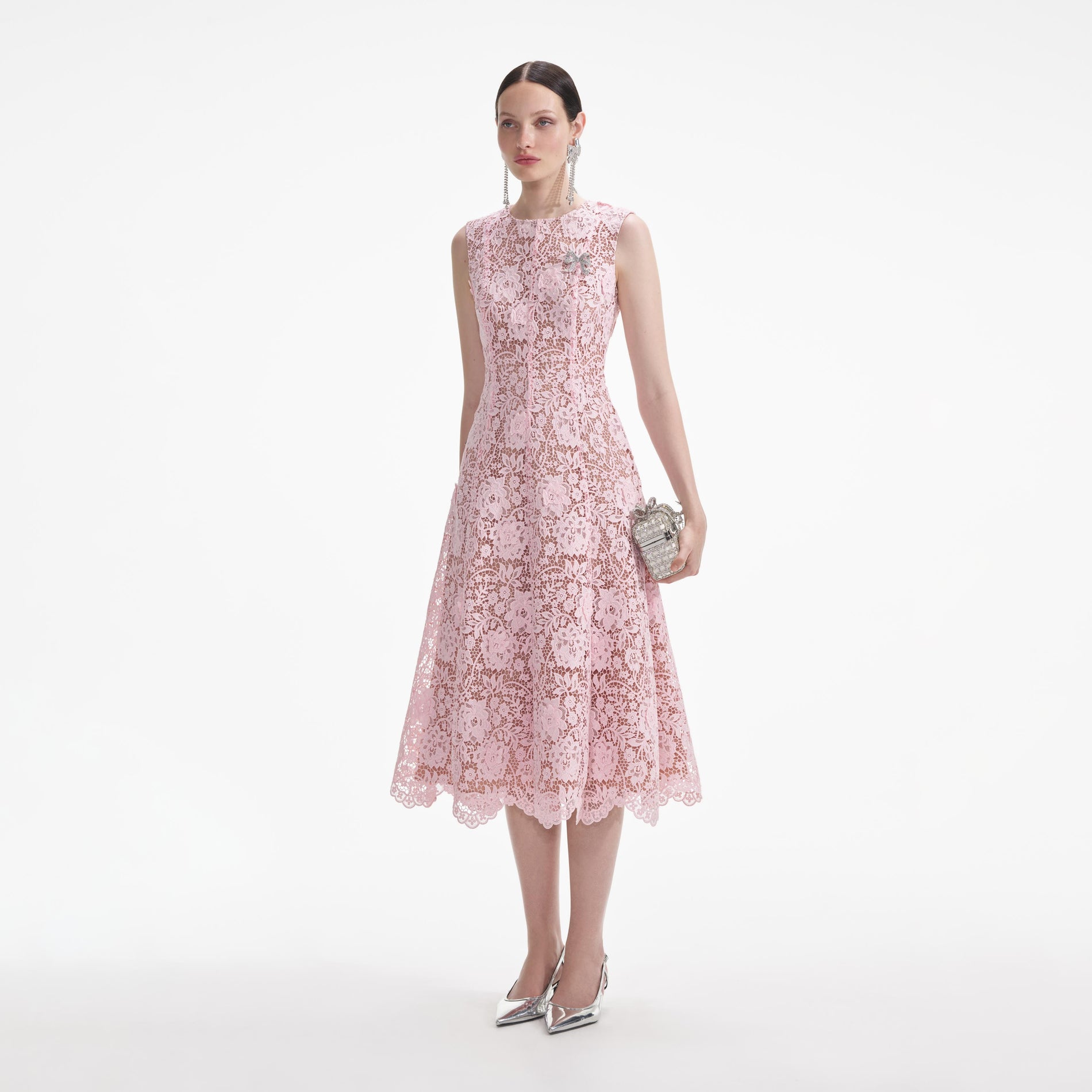 Side view of a woman wearing the Pink Flower Lace Midi Dress
