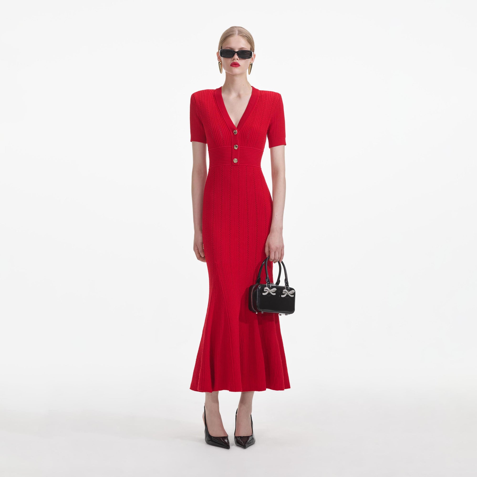 Front view of a woman wearing the Red Pointelle Knit Midi Dress