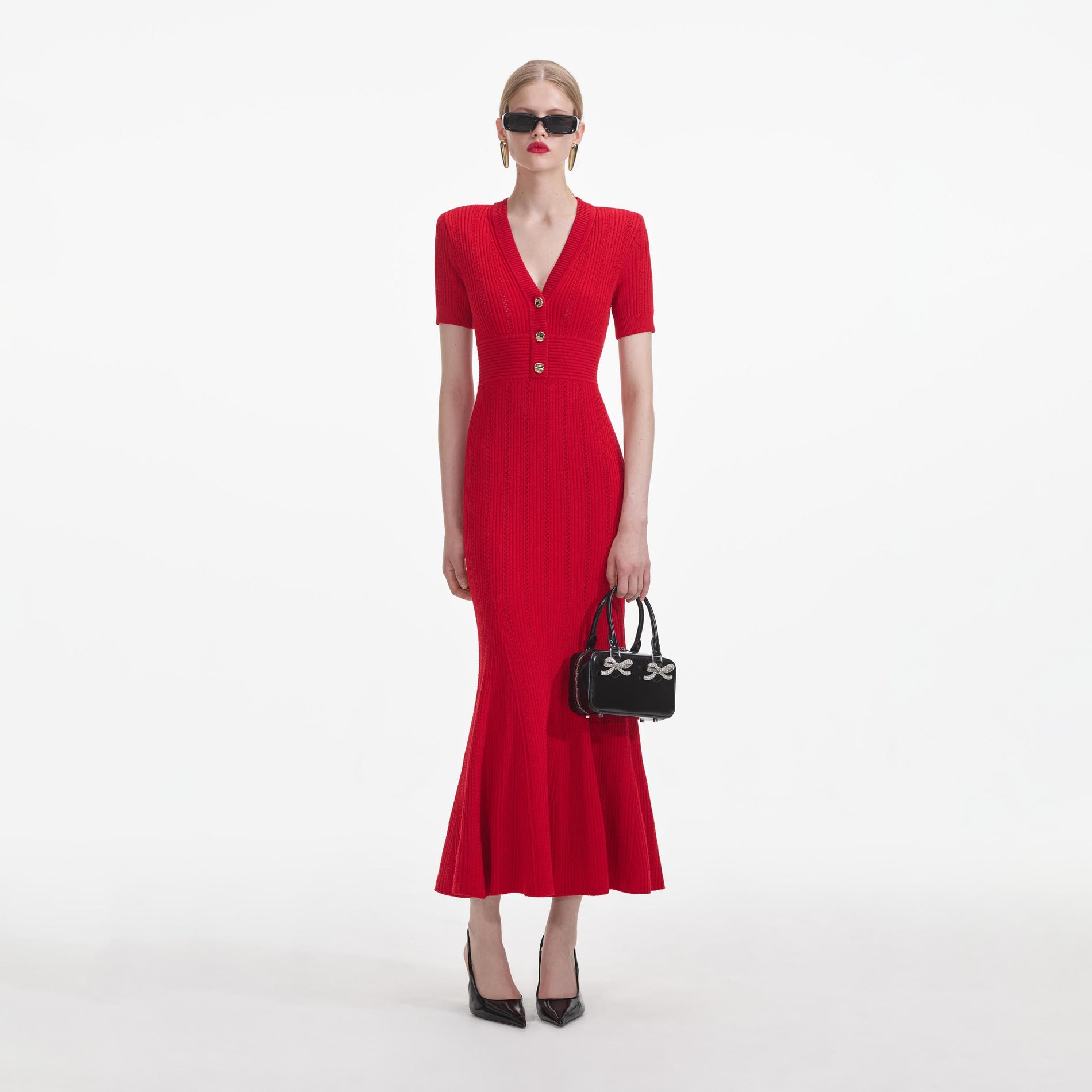 Front view of a woman wearing the Red Pointelle Knit Midi Dress