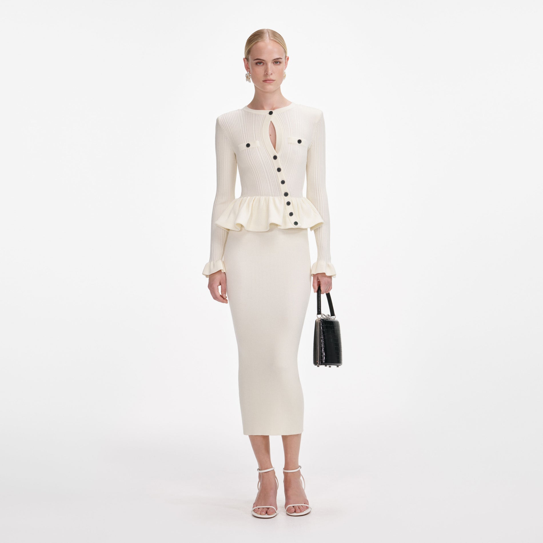 Front view of a woman wearing the Cream Asymmetric Knit Midi Dress