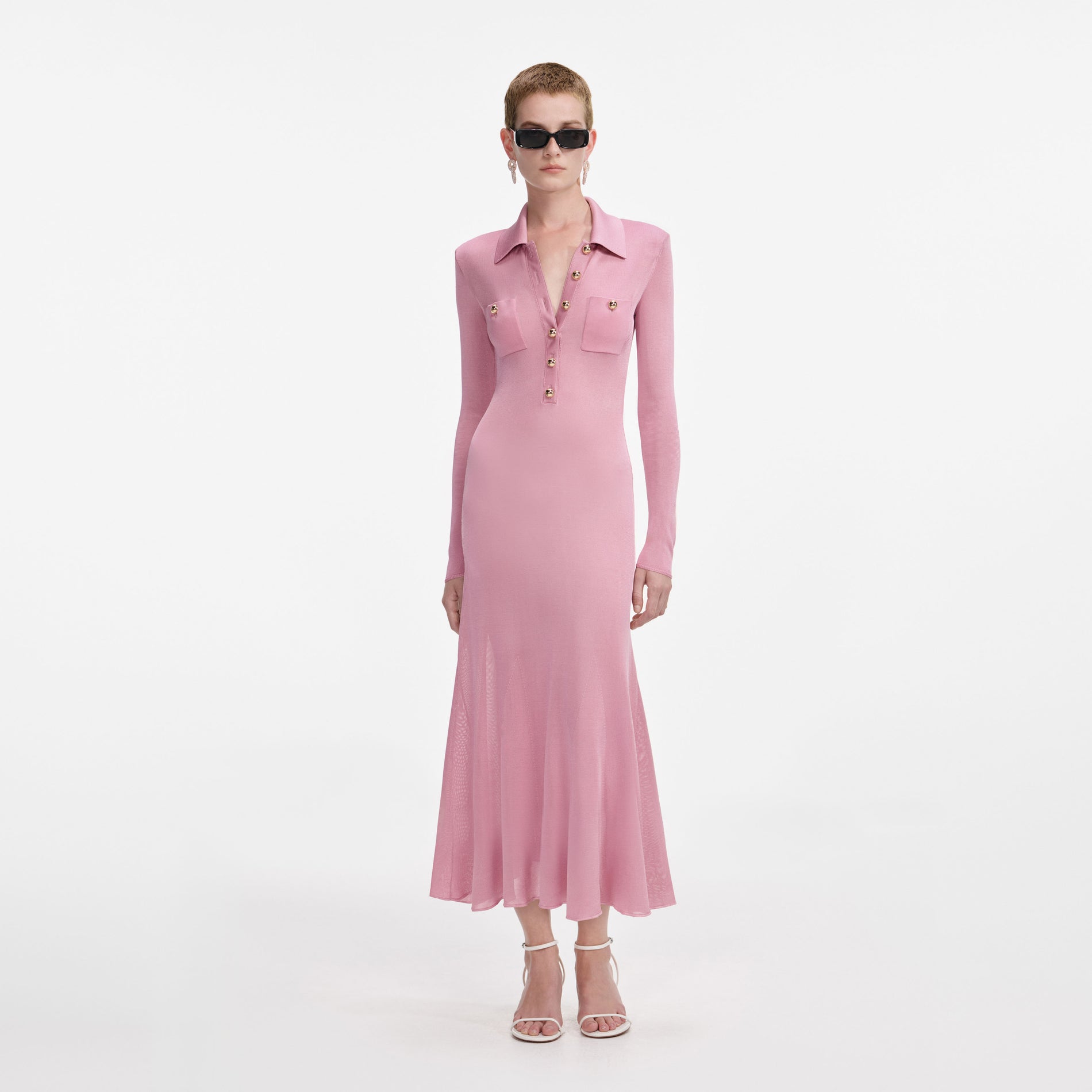 Front view of a woman wearing the Pink Viscose Knit Midi Dress