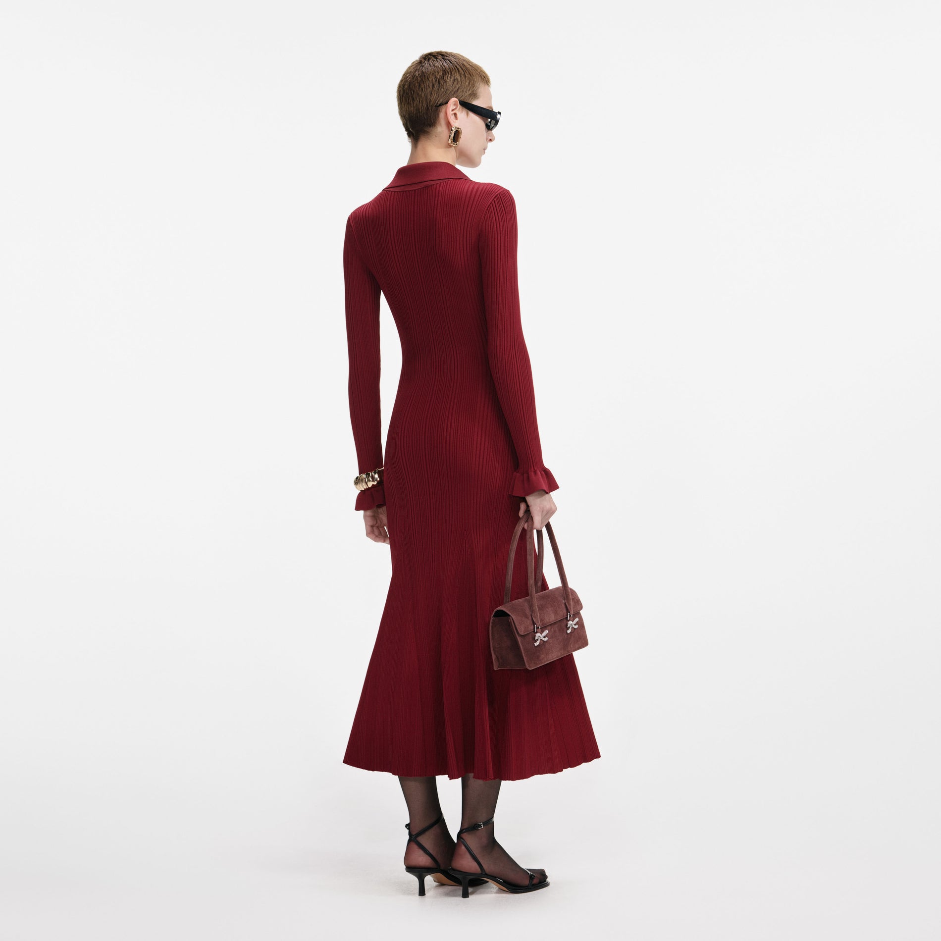 Back view of a woman wearing the Burgundy Ribbed Knit Midi Dress