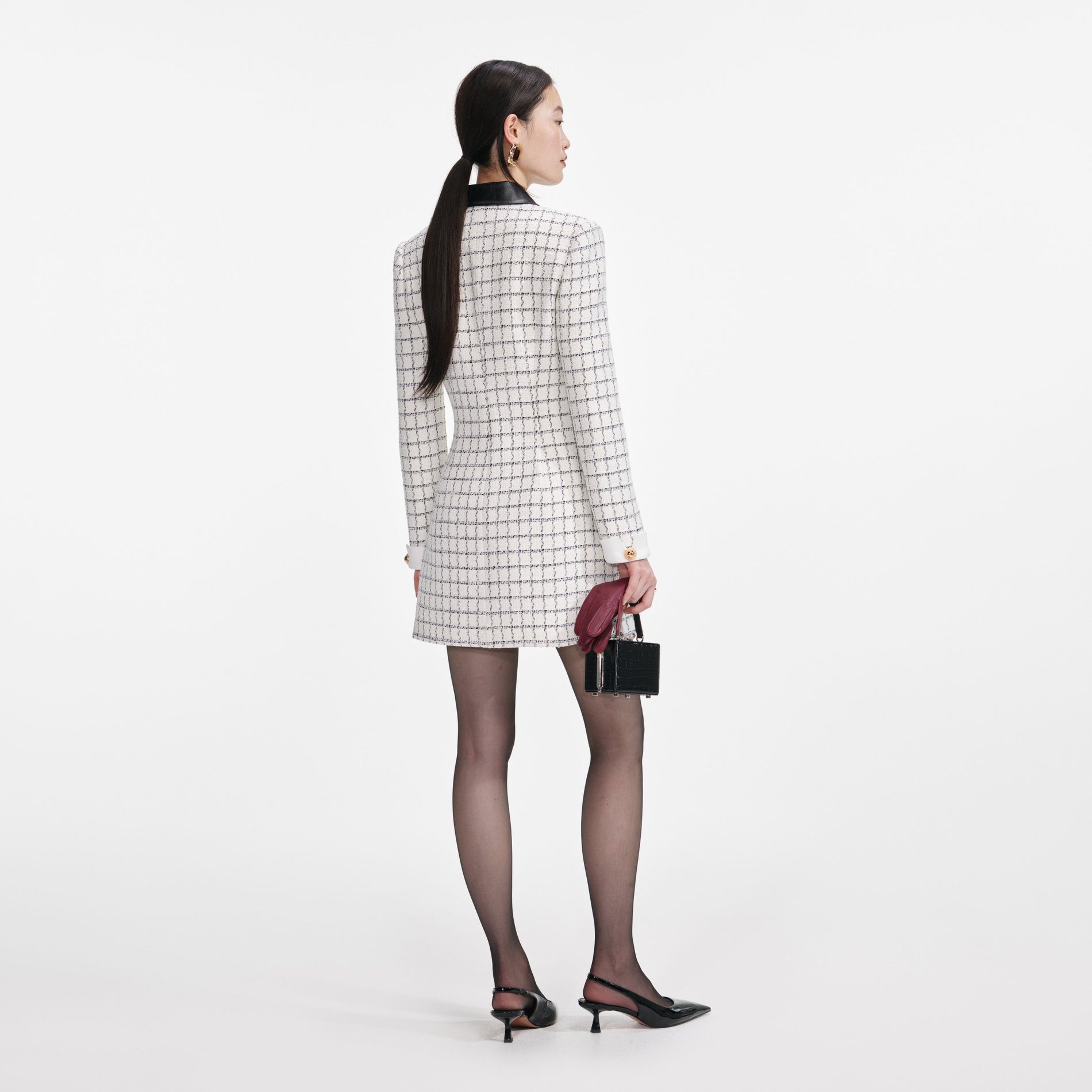 Back view of a woman wearing the Check Boucle Long Sleeve Mini Dress