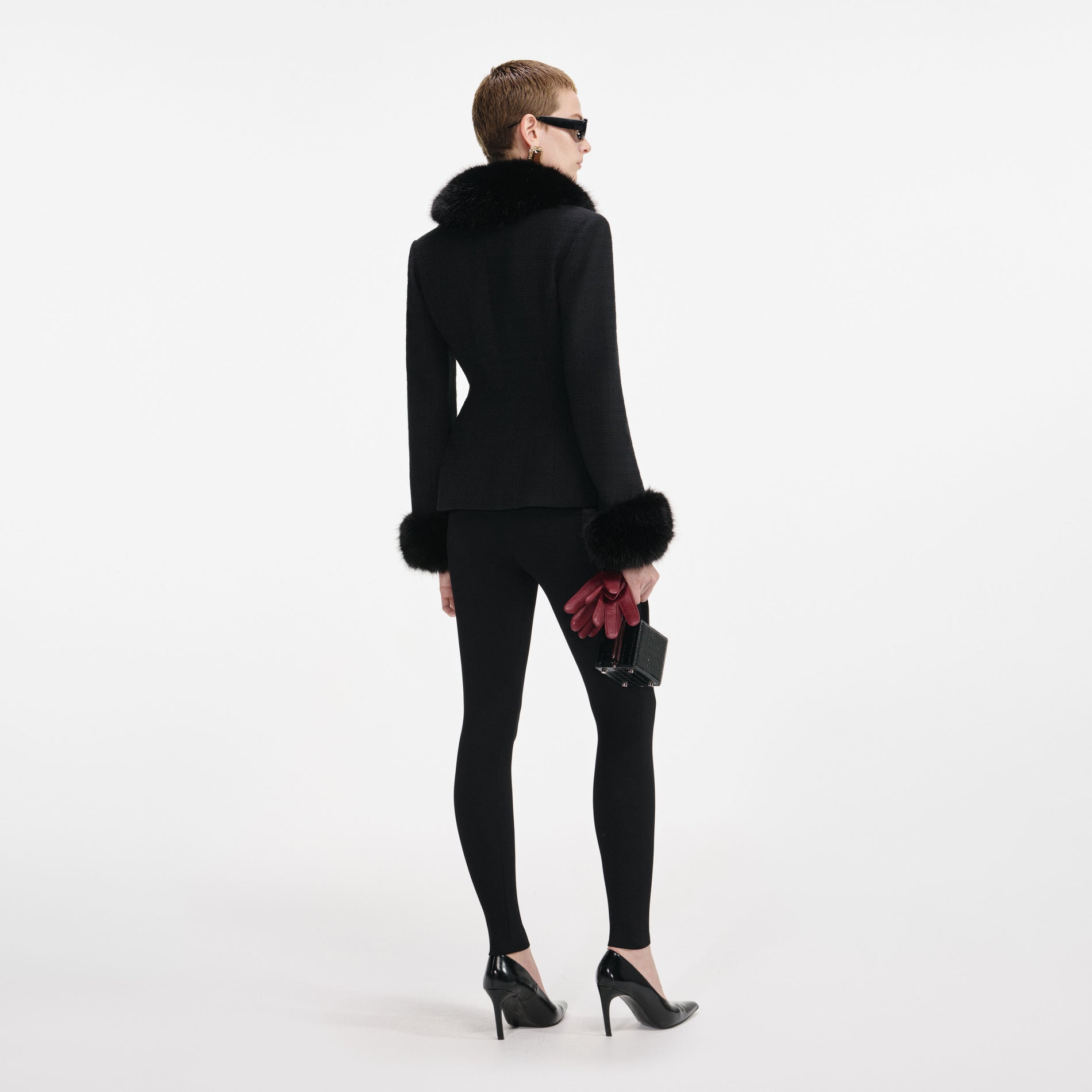 Back view of a woman wearing the Black Tailored Boucle Fur Jacket