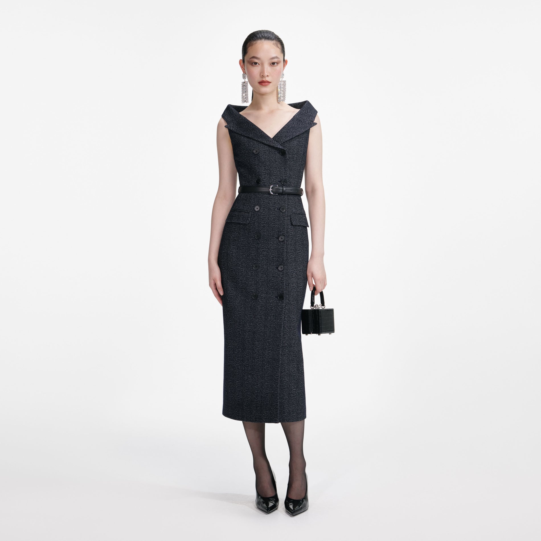 Front view of a woman wearing the Navy Herringbone Wool Midi Dress