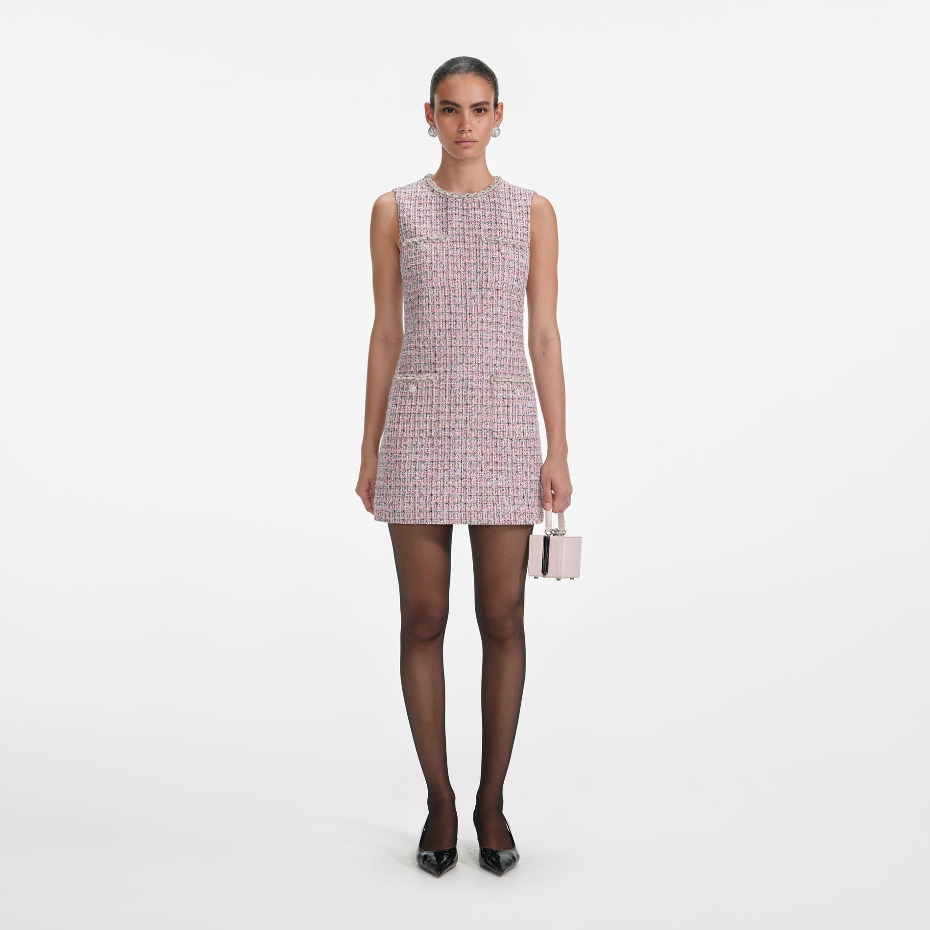 Front view of a woman wearing the Pink Boucle Sleeveless Mini Dress