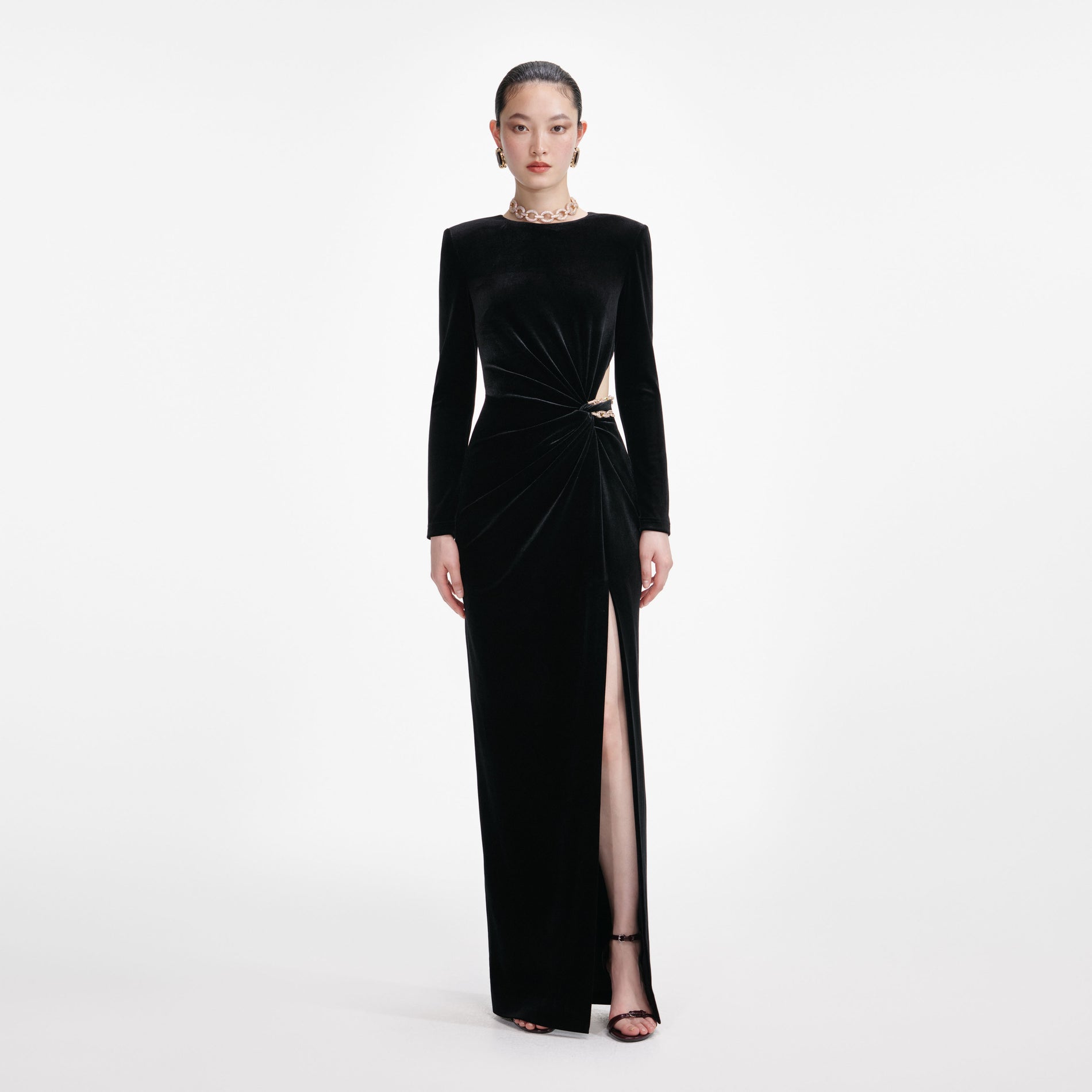 Front view of a woman wearing the Black Velvet Embellished Maxi Dress