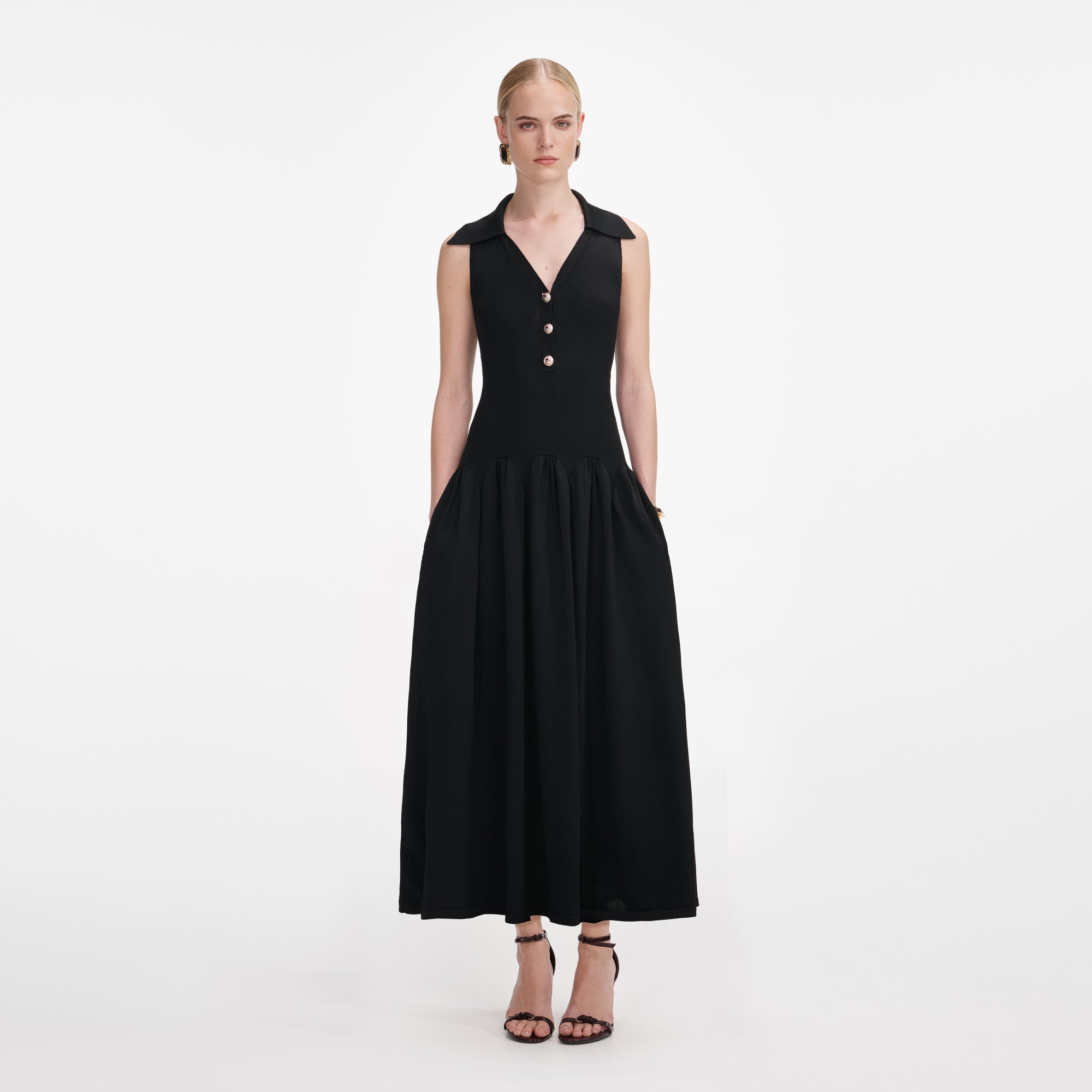 Front view of a woman wearing the Black Ribbed Knit Midi Dress