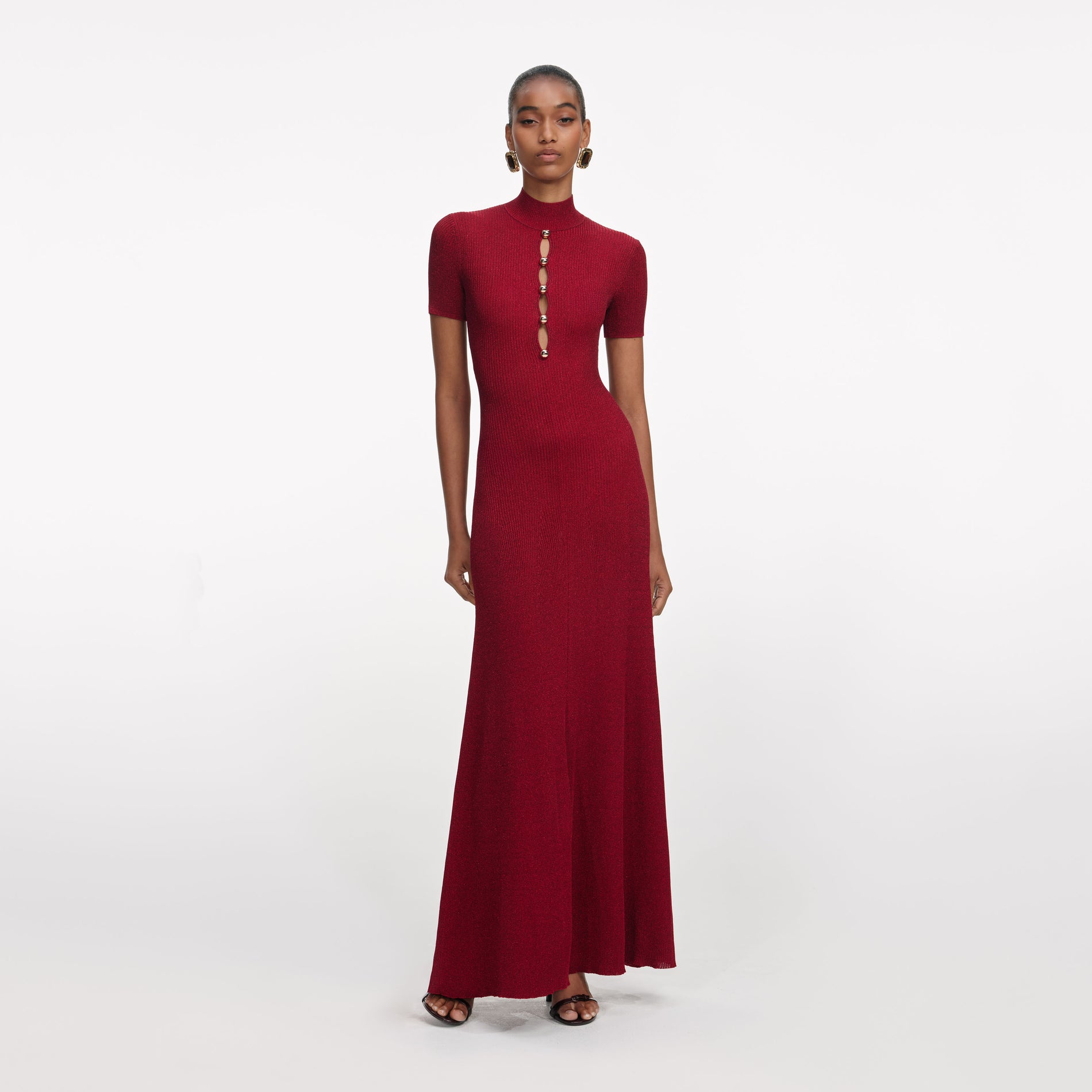 Front view of a woman wearing the Red Lurex Knit Maxi Dress