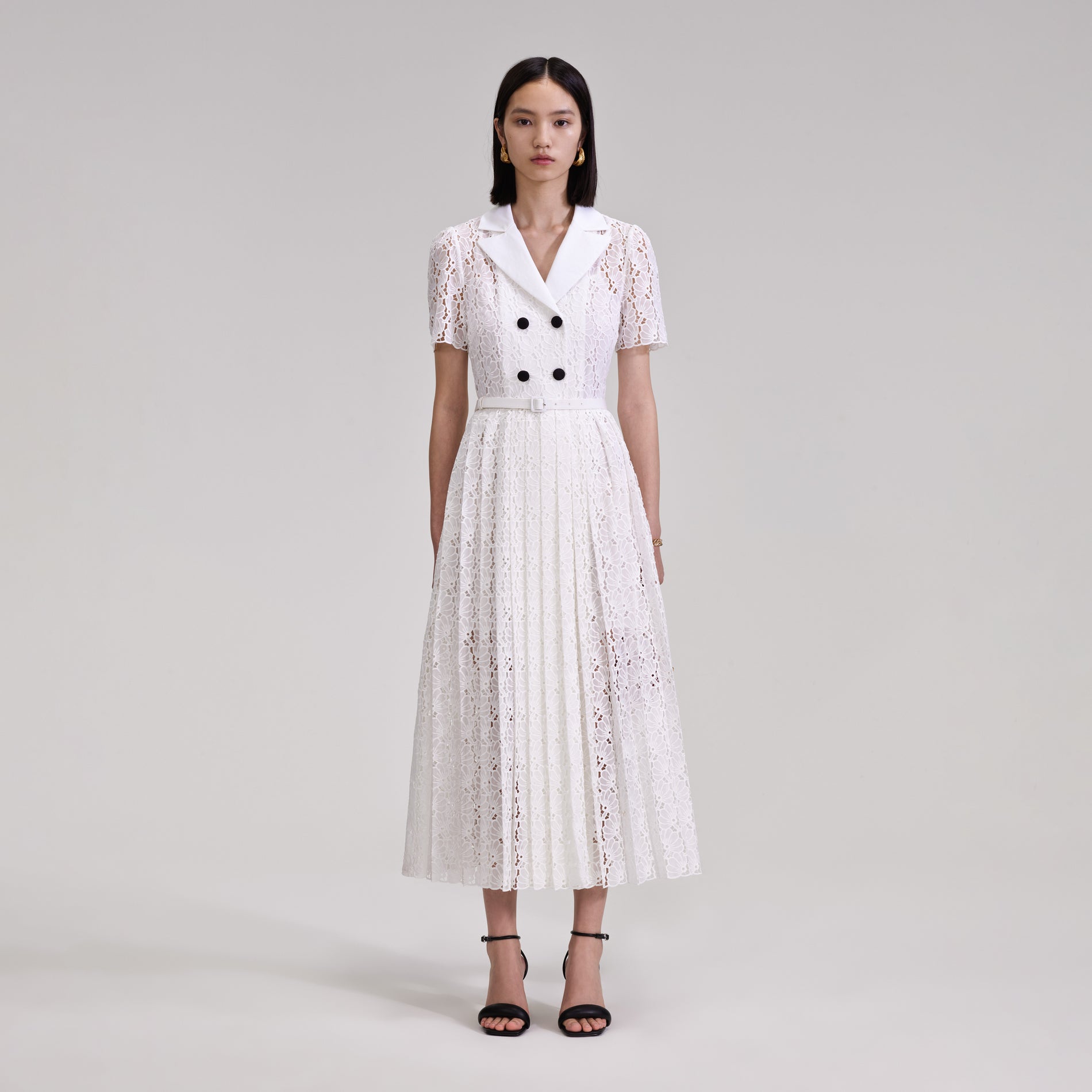 A woman wearing the White Floral Chiffon Midi Dress