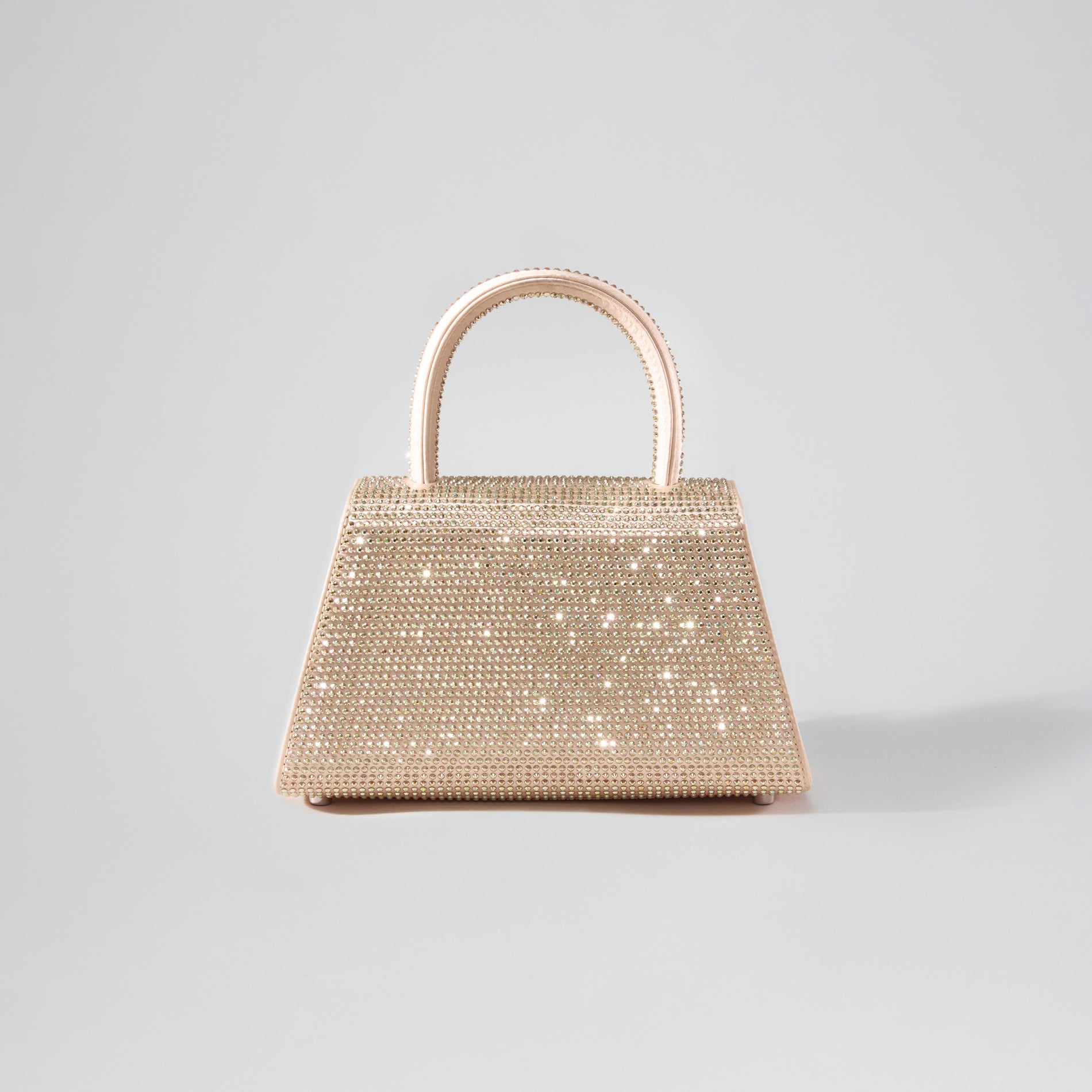Back view of a woman wearing the Gold Rhinestone Mini Bow Bag