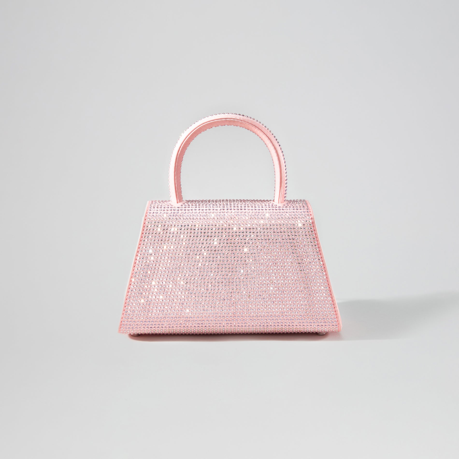 Back view of a woman wearing the Pink Rhinestone Mini Bow Bag