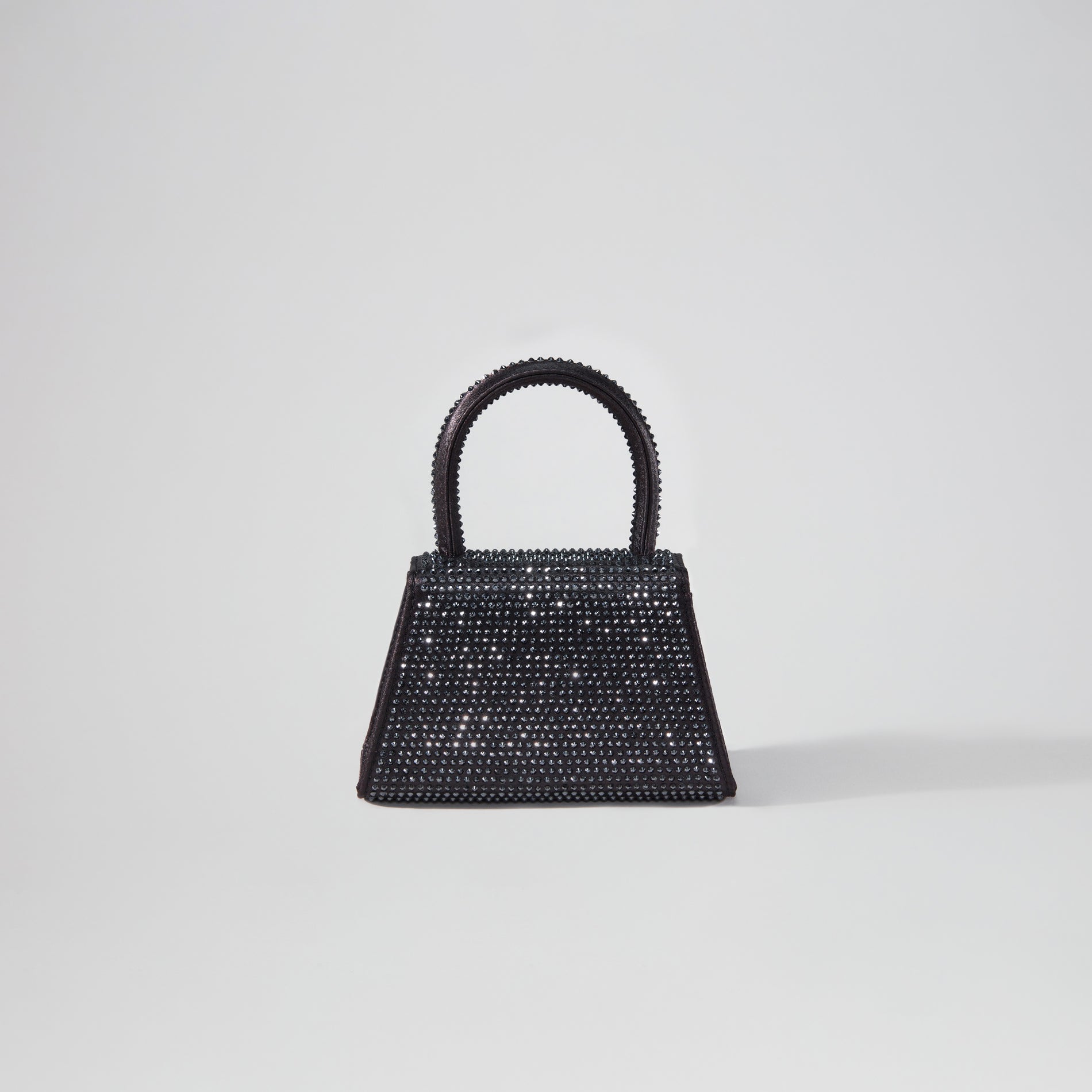 Back view of a woman wearing the Black Rhinestone Micro Bow Bag