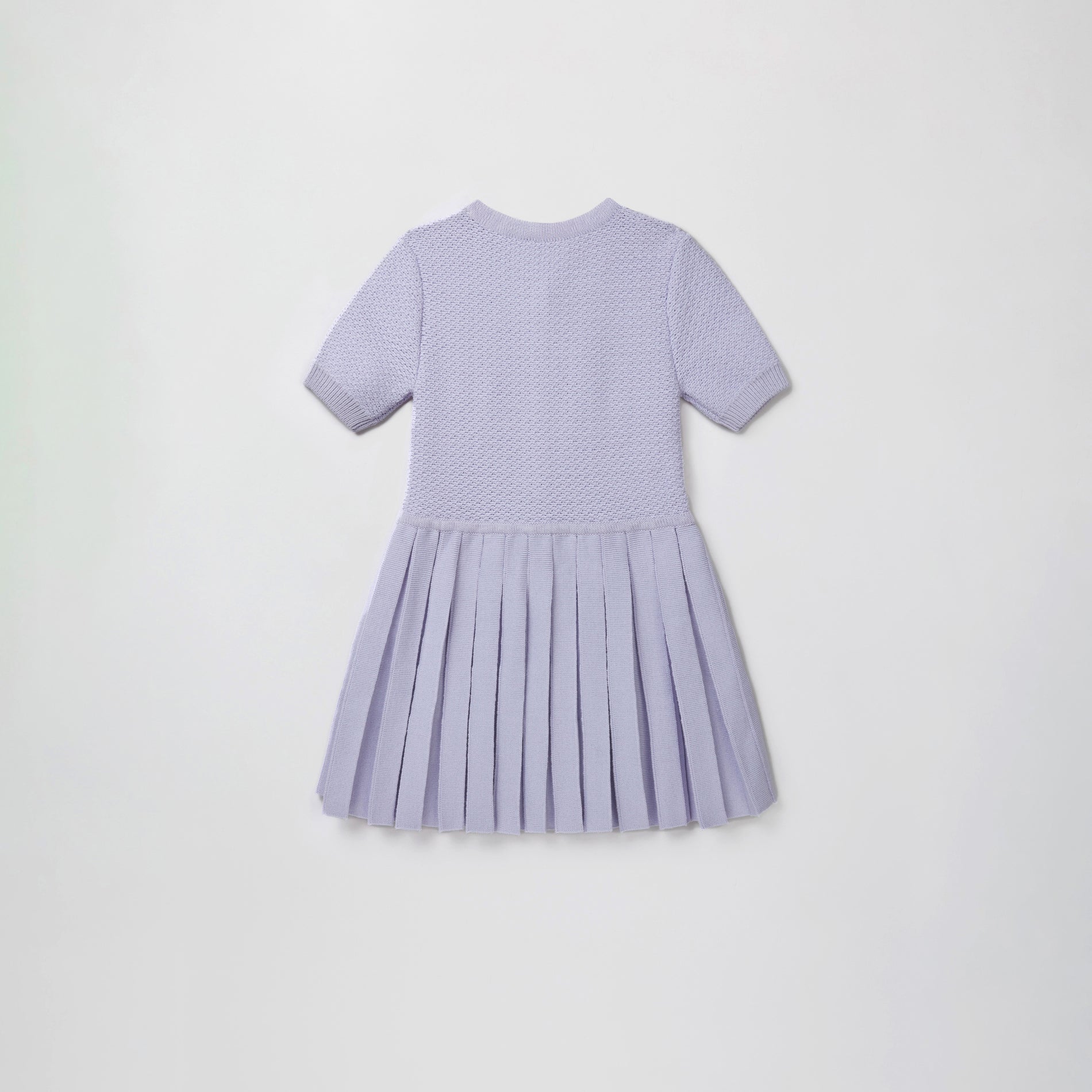 Side view of a woman wearing the Lilac Knit Dress