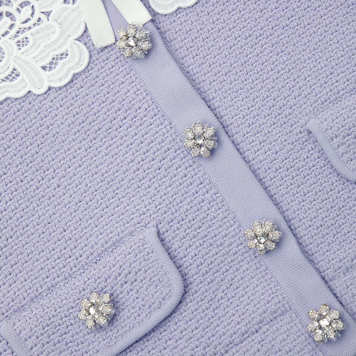 A close up of the fabric for the Lilac Knit Lace Collar Cardigan