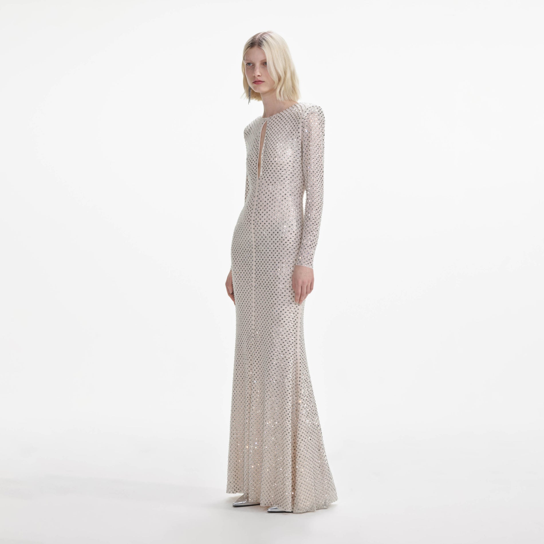 Side view of a woman wearing the Cream Rhinestone Keyhole Maxi Dress