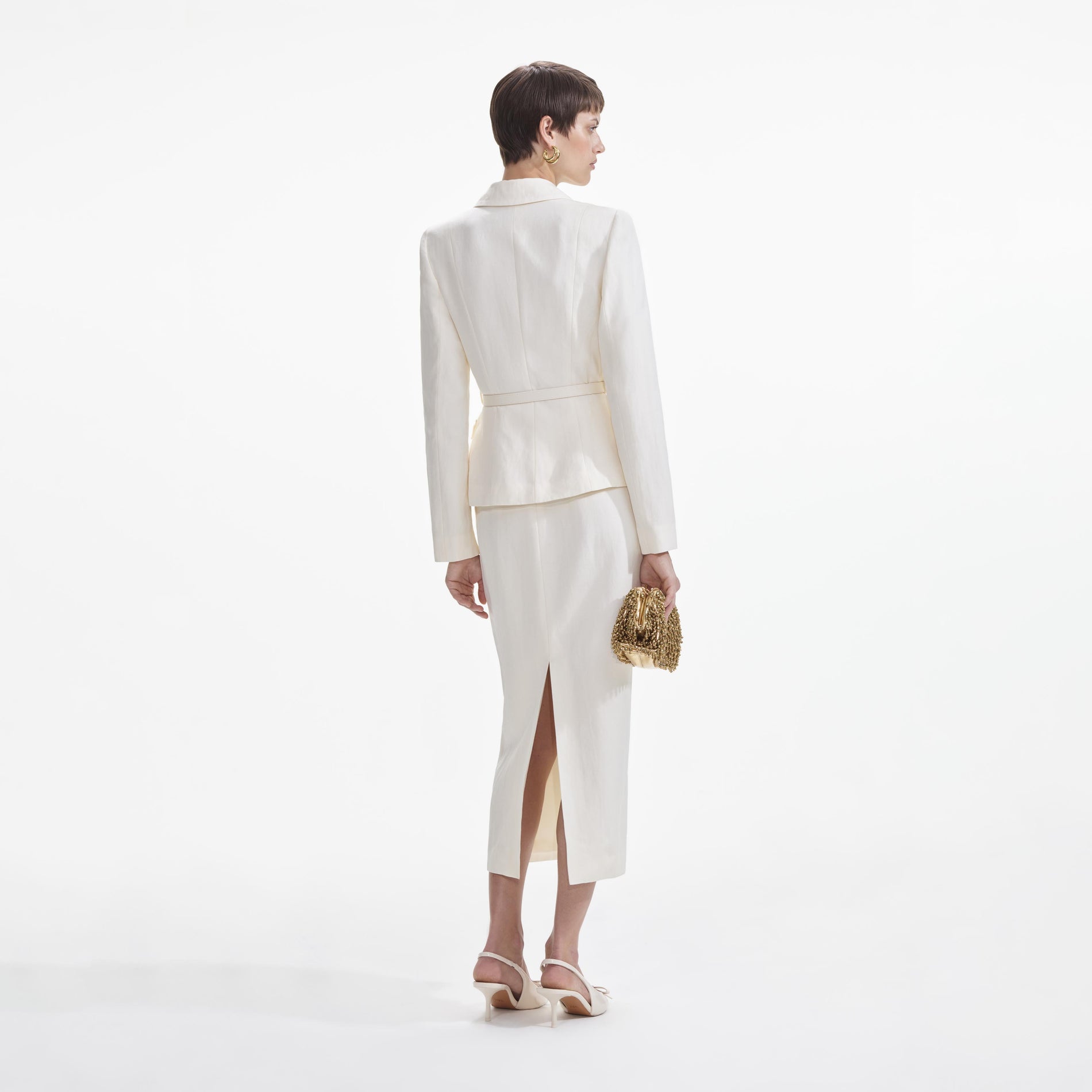 Back view of a woman wearing the Cream Linen Tailored Midi Dress