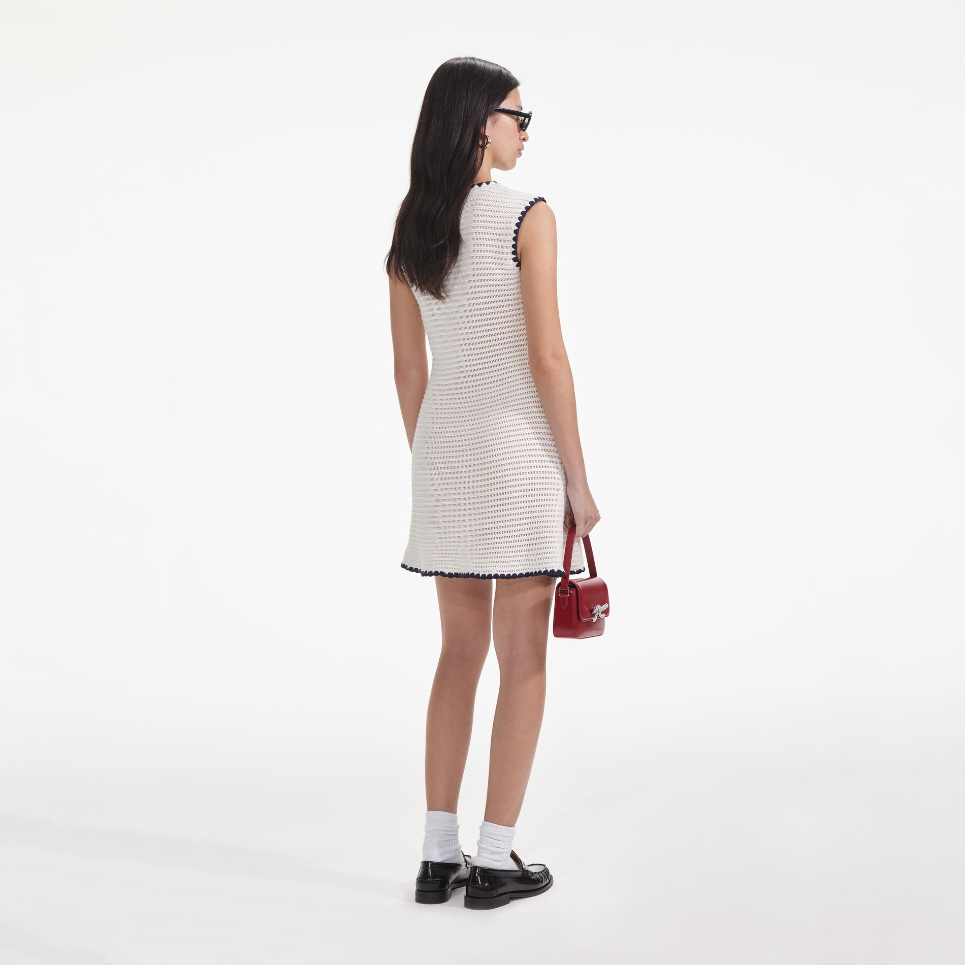 Back view of a woman wearing the Cream Crochet Contrast Trim Mini Dress