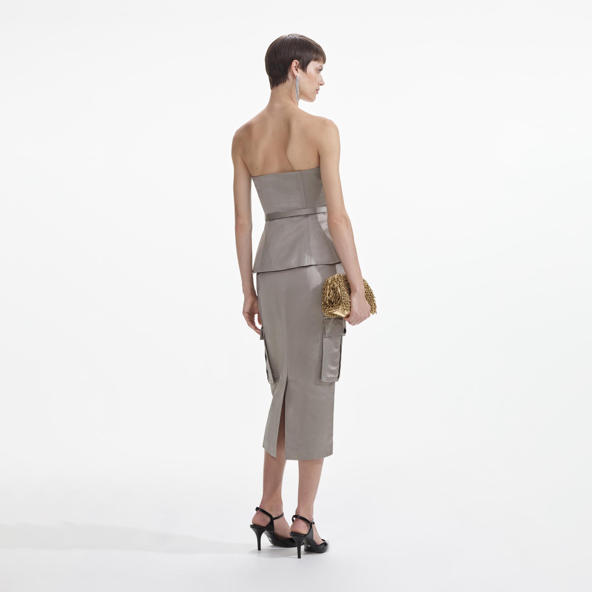 Back view of a woman wearing the Taupe Satin Corset Top