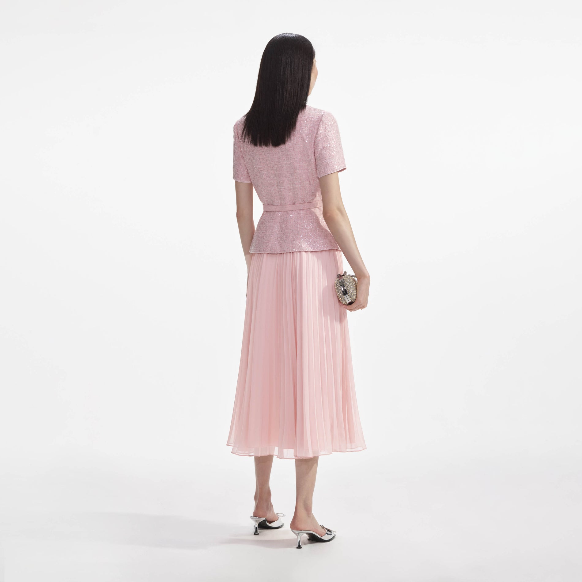 Back view of a woman wearing the Pink Boucle Midi Dress