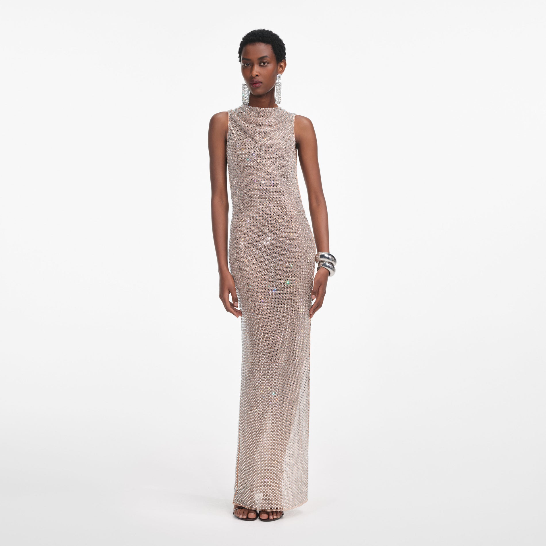 Front view of a woman wearing the Silver Rhinestone Drape Maxi Dress