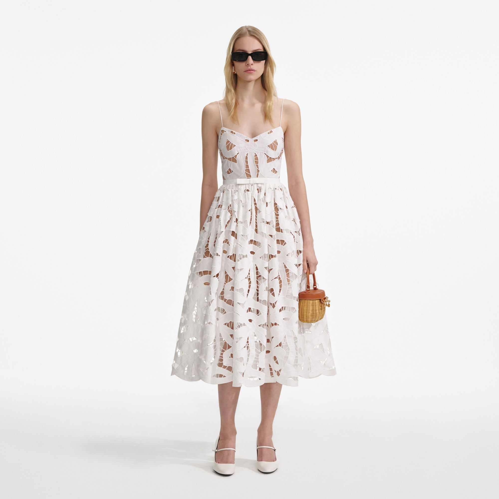 Front view of a woman wearing the White Bow Embroidered Midi Dress