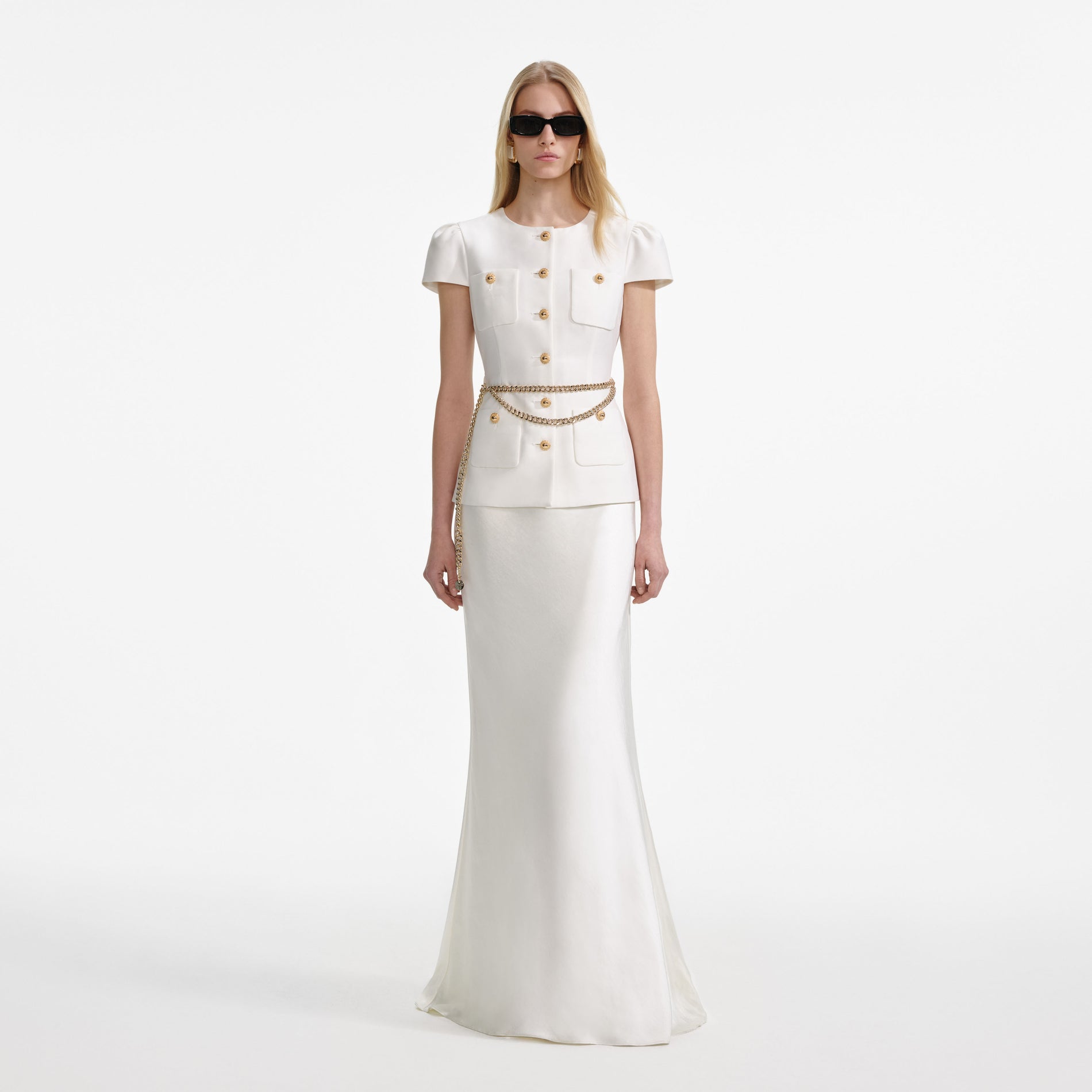 Front view of a woman wearing the Cream Taffeta Chain Belt Maxi Dress