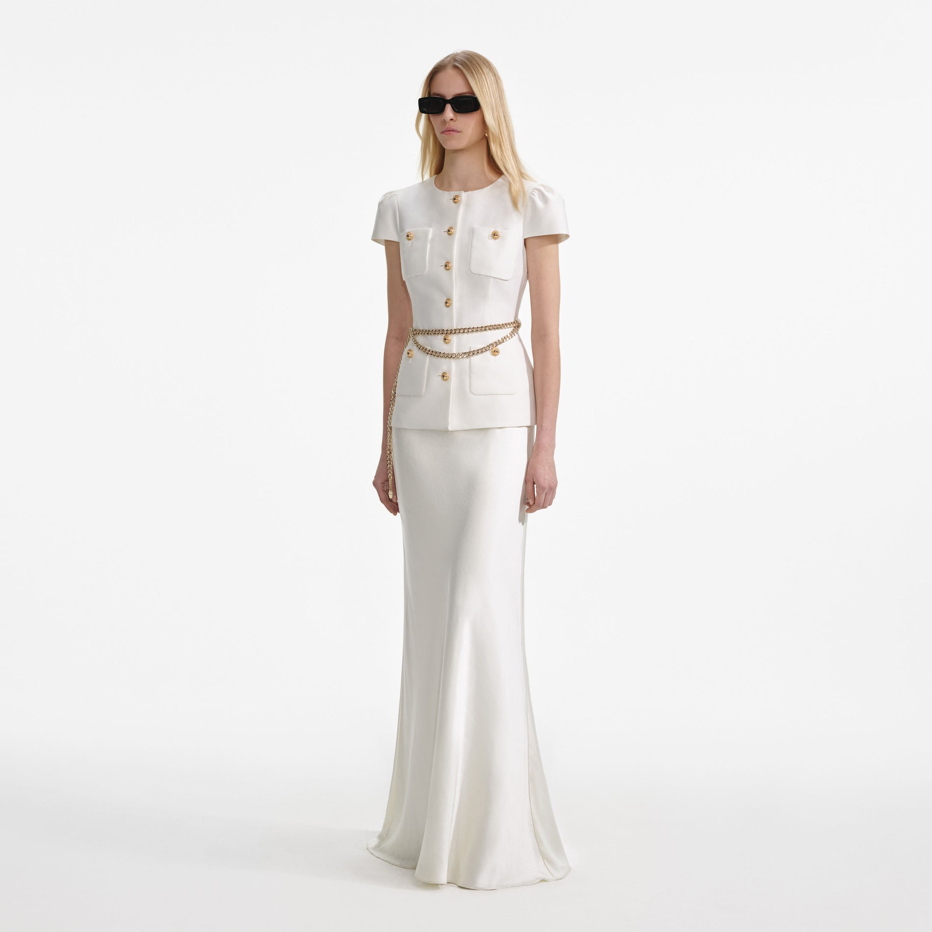 Side view of a woman wearing the Cream Taffeta Chain Belt Maxi Dress