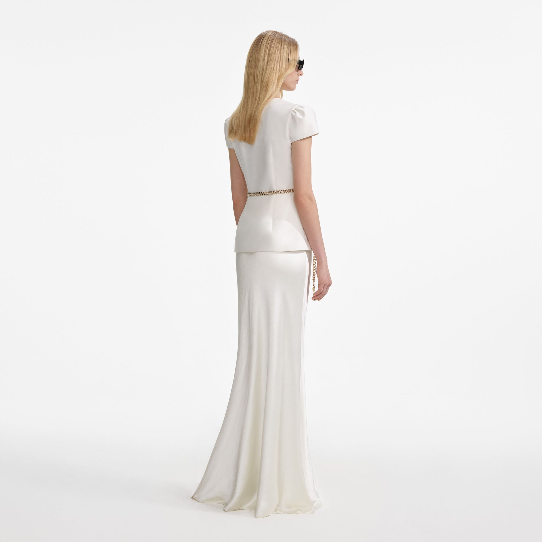 Back view of a woman wearing the Cream Taffeta Chain Belt Maxi Dress