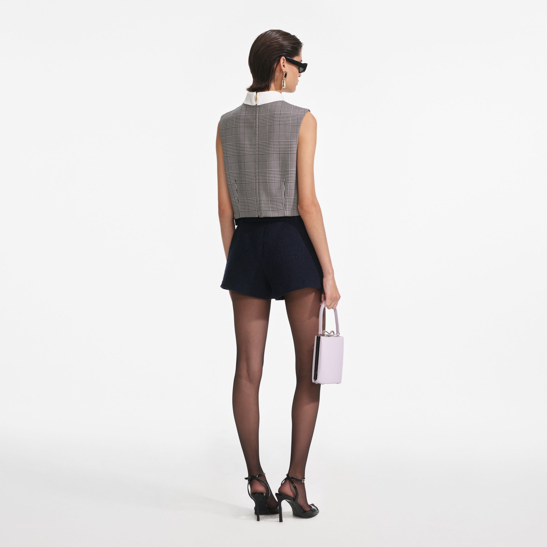 Back view of a woman wearing the Navy Boucle Skort