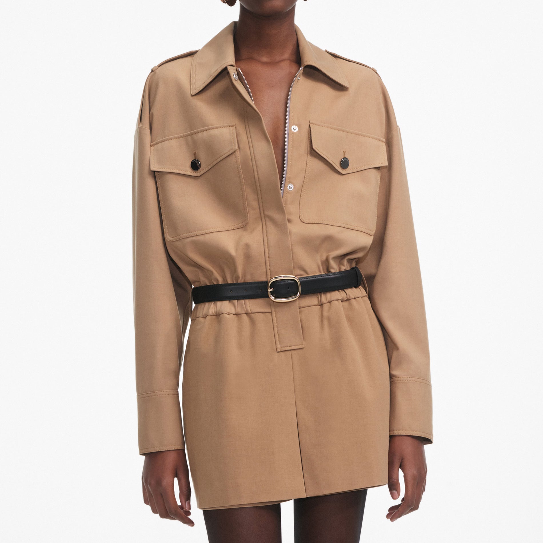 A close up of a woman wearing the Tan Twill Playsuit