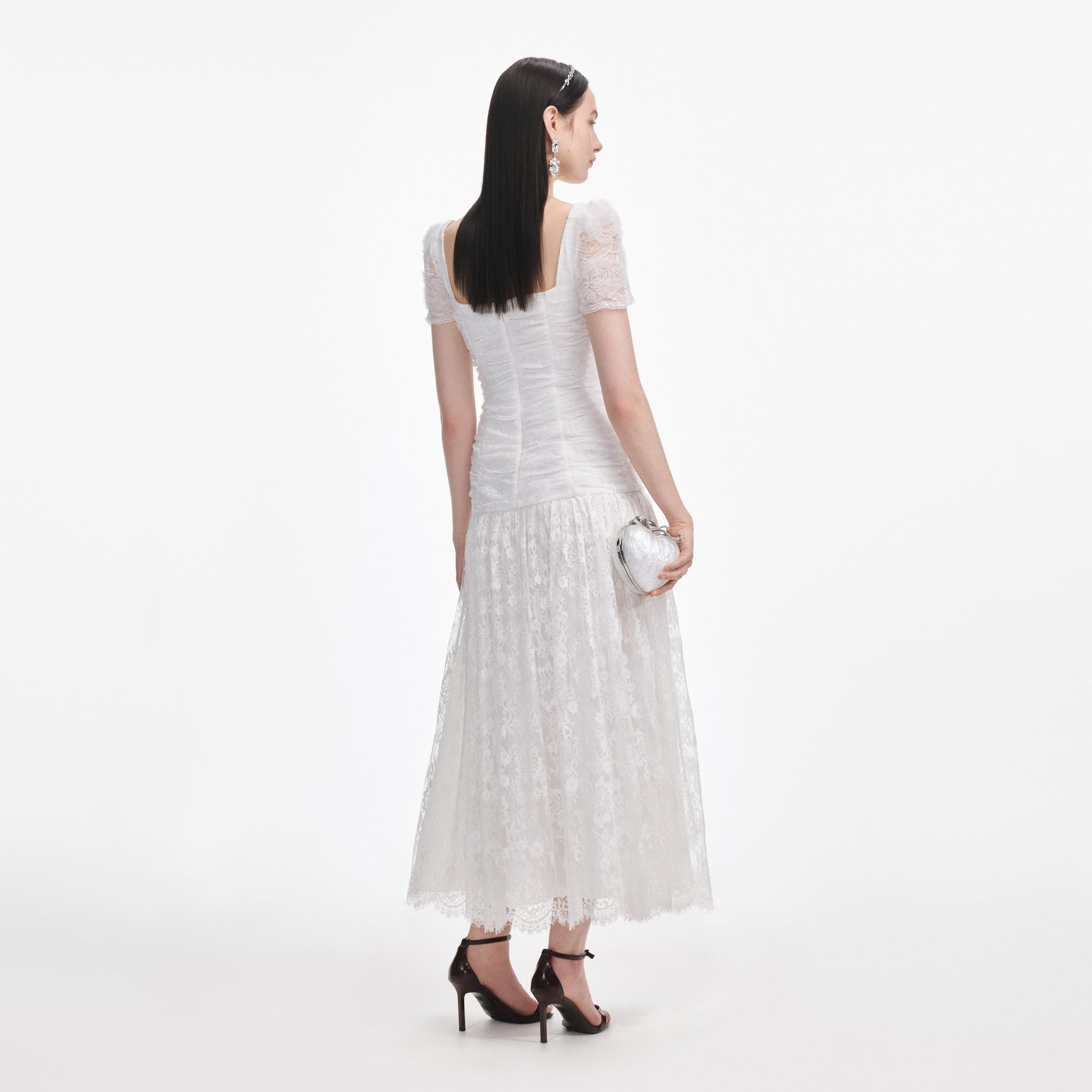 Back view of a woman wearing the White Tulle Lace Gathered Midi Dress