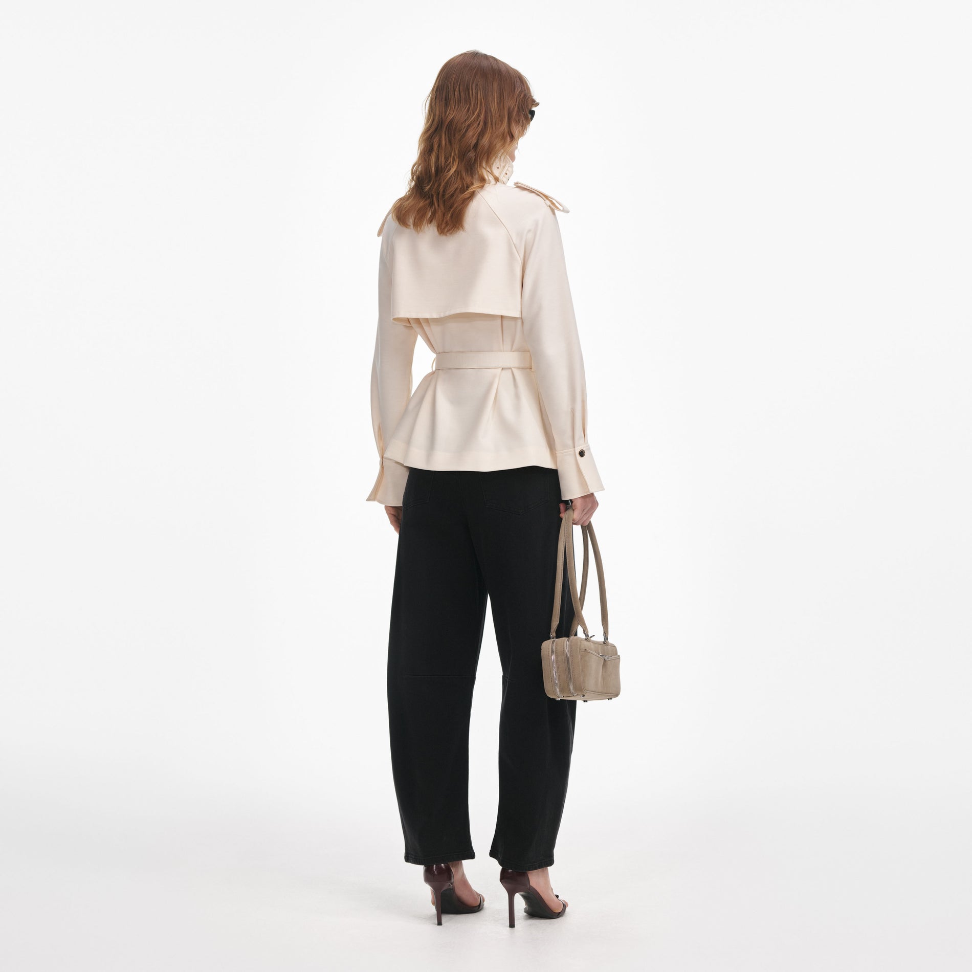 Back view of a woman wearing the Cream Twill Jacket